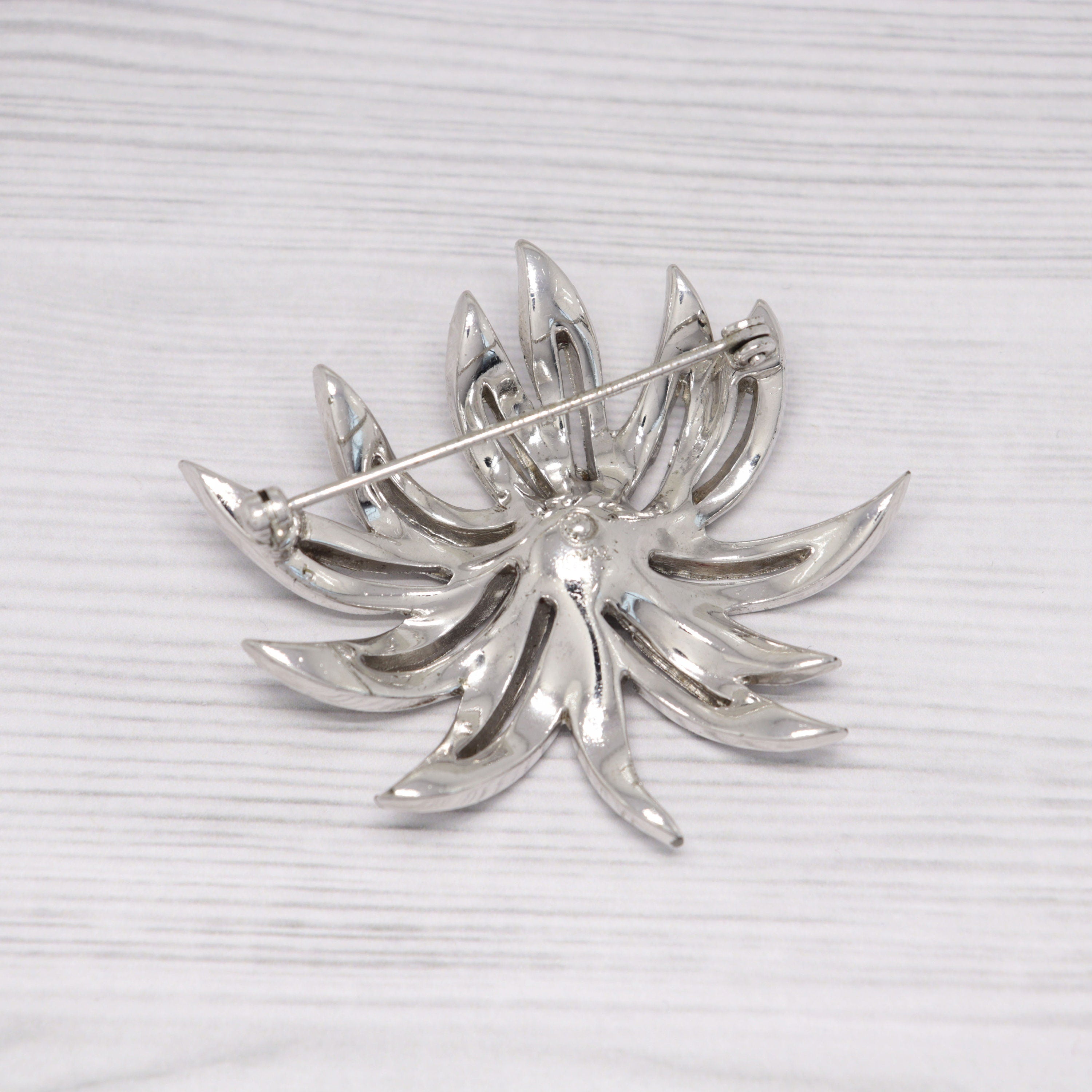Vintage Jomaz silver-tone and rhinestone flower brooch