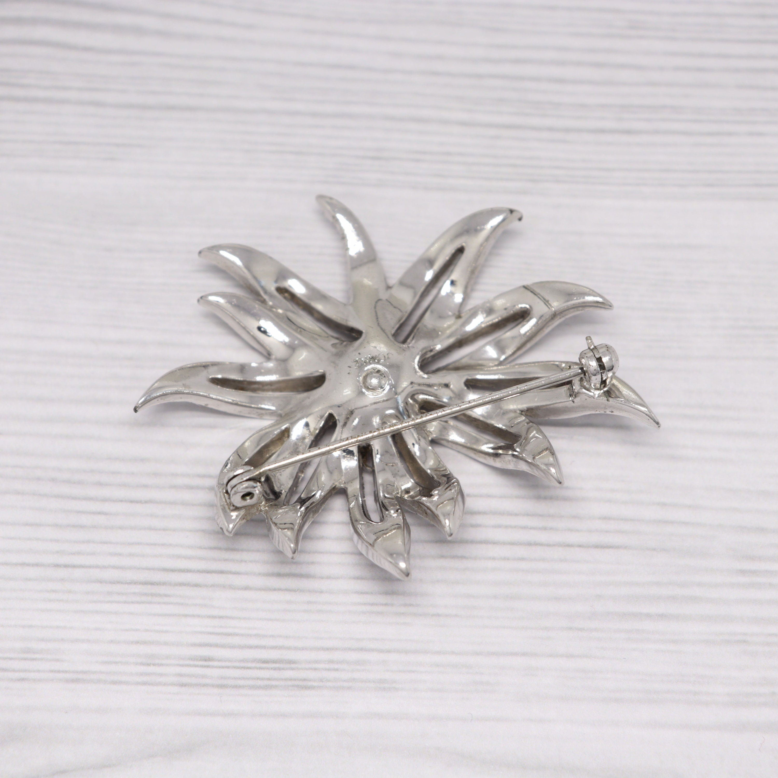 Vintage Jomaz silver-tone and rhinestone flower brooch