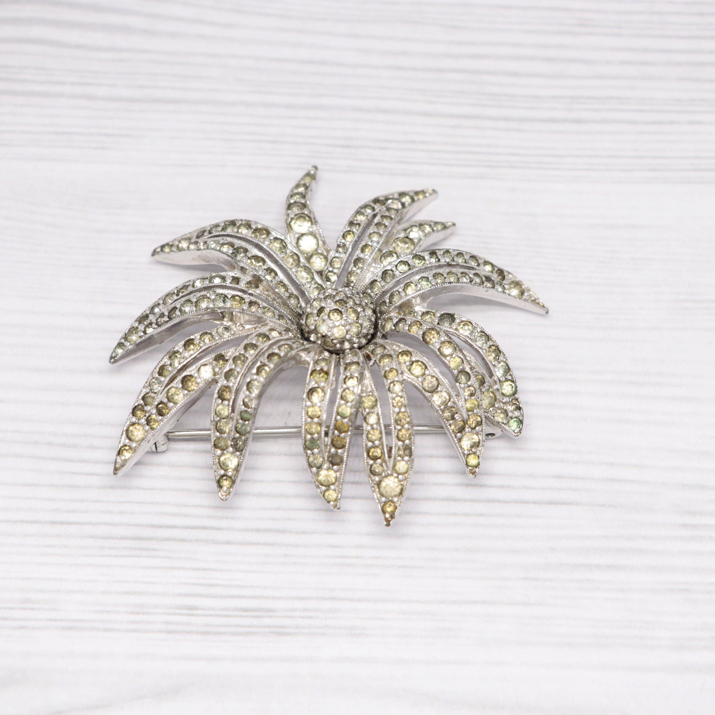 Vintage Jomaz silver-tone and rhinestone flower brooch
