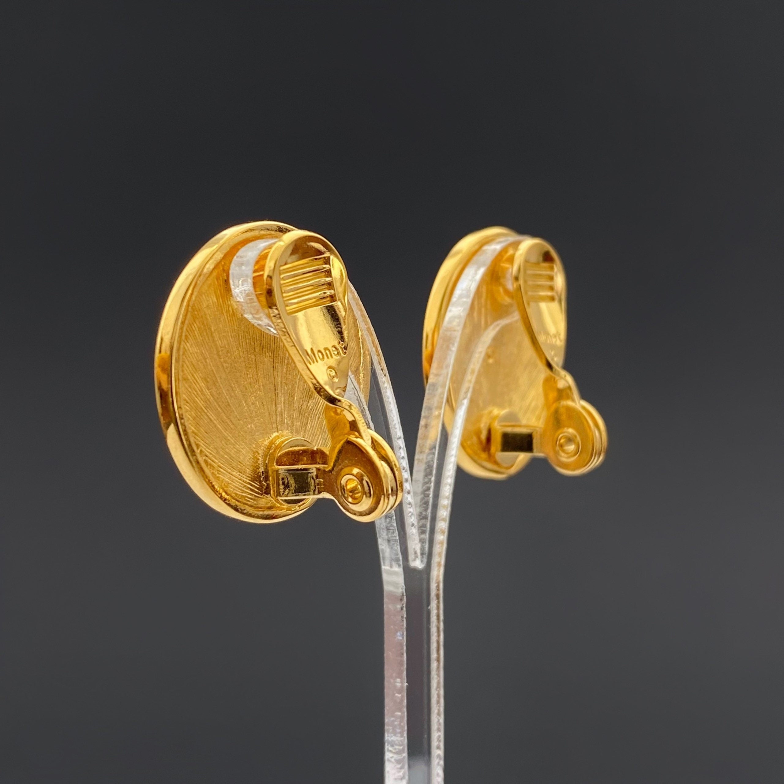Vintage MONET Clip On Earrings: Gold Tone Beige Swirl Enamel