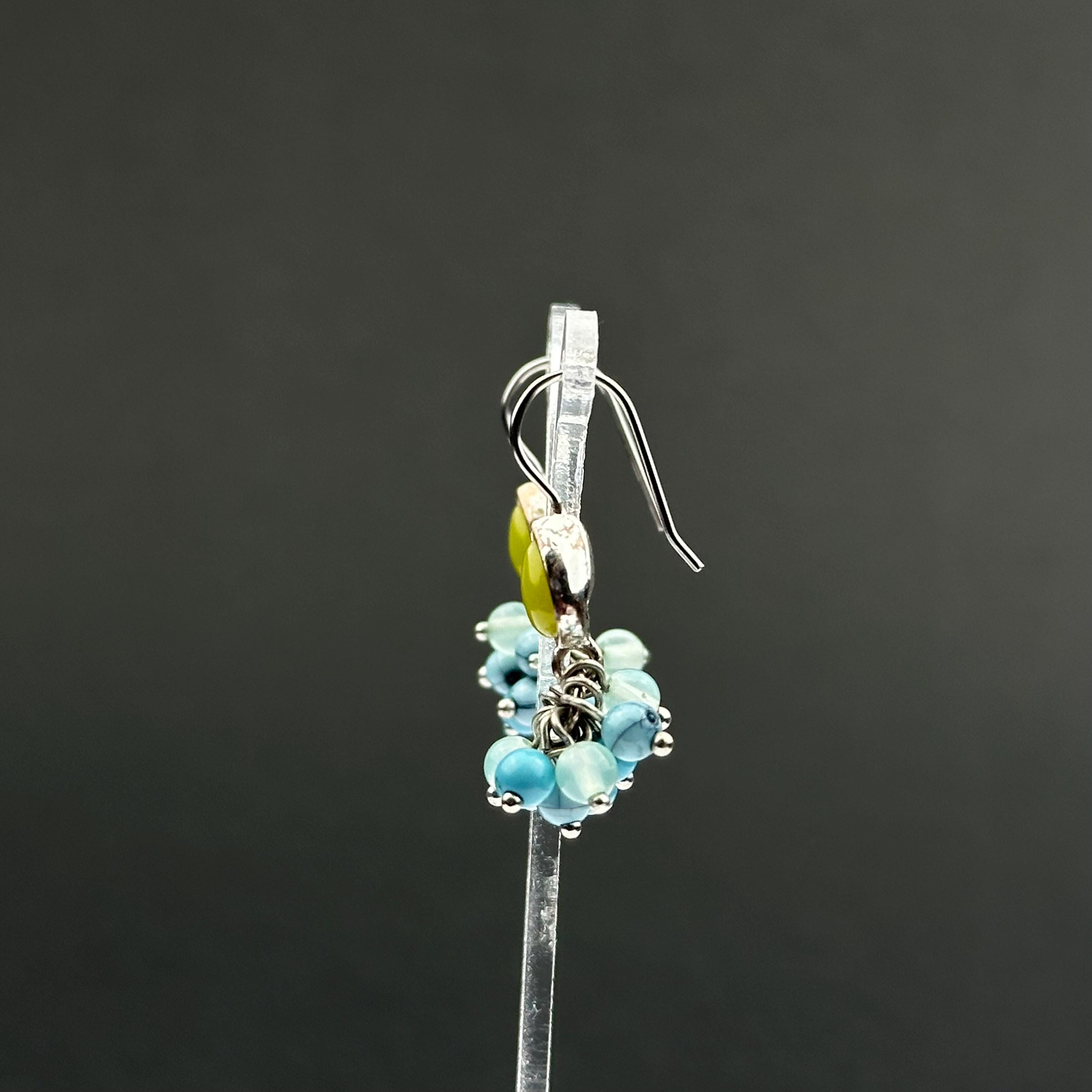 Vintage Monet drop earrings with green and blue bead