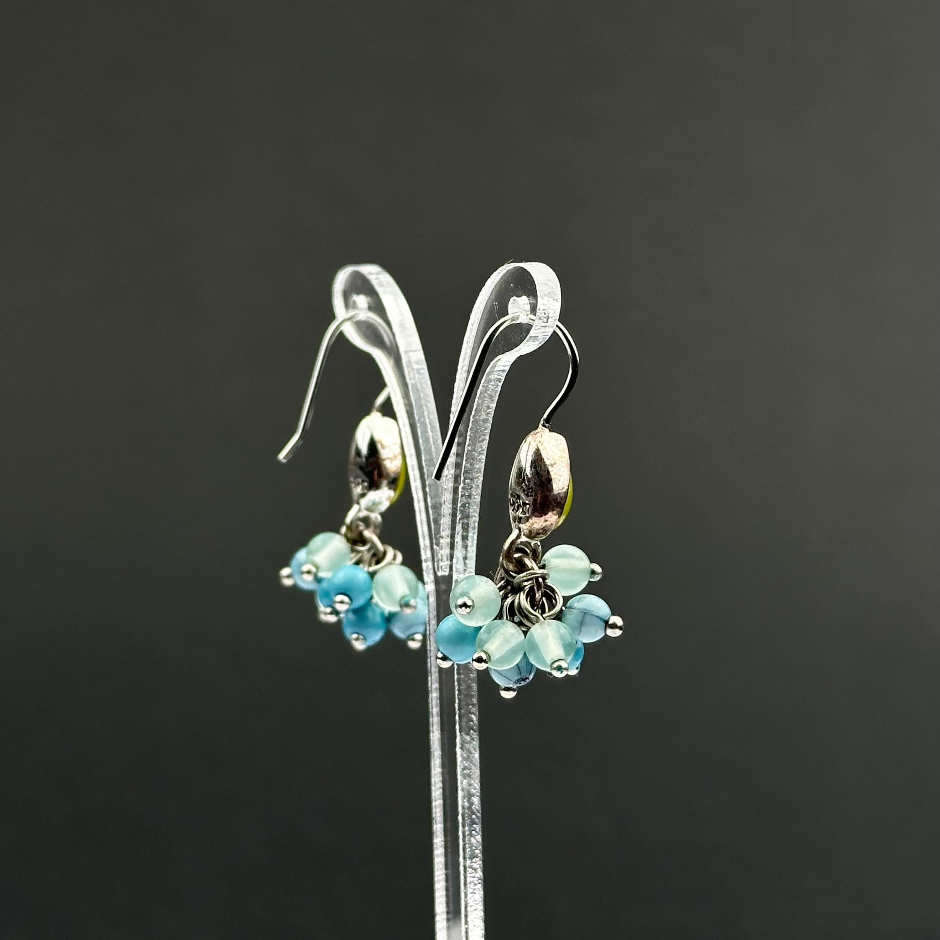 Vintage Monet drop earrings with green and blue bead