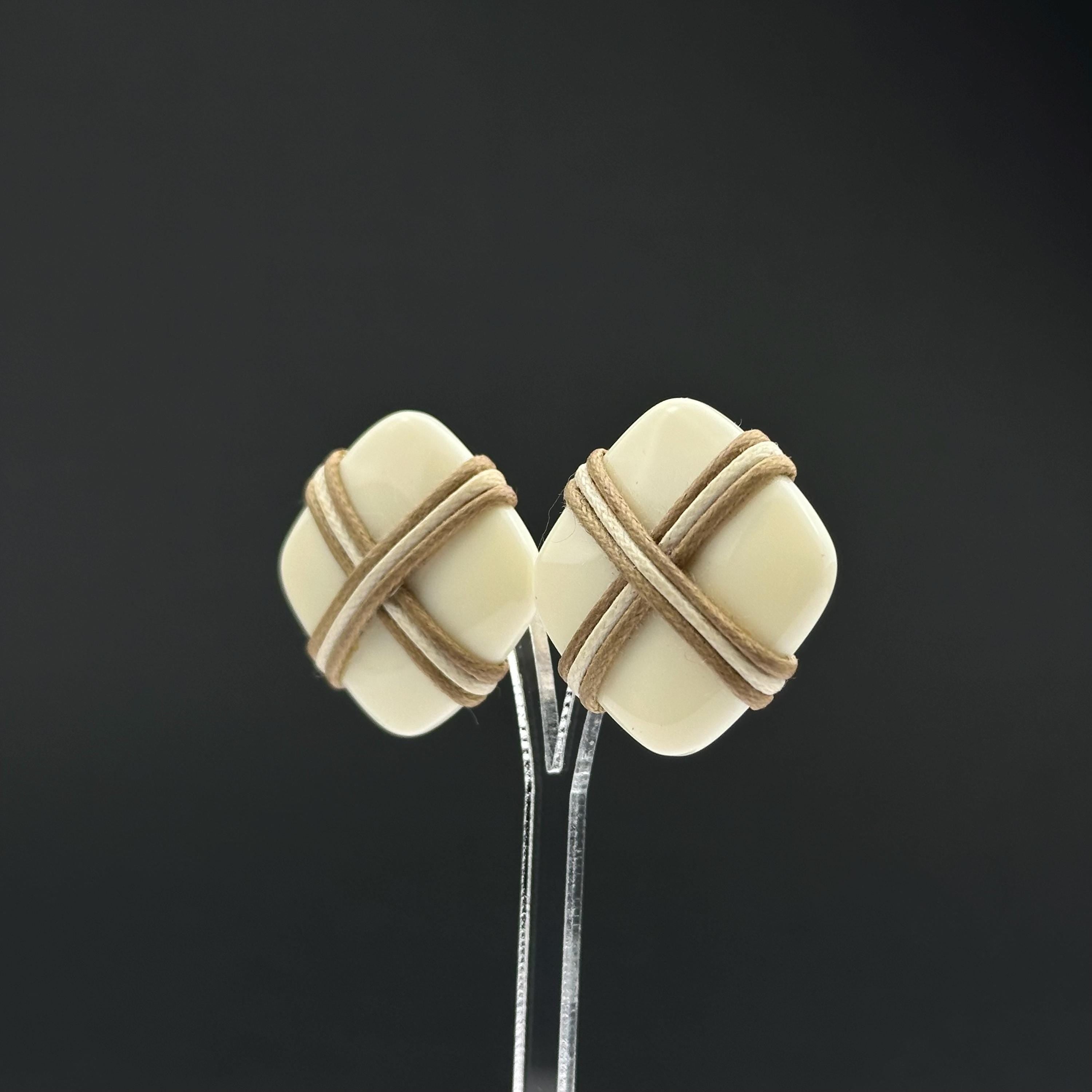 Vintage white plastic geometric clip on earrings