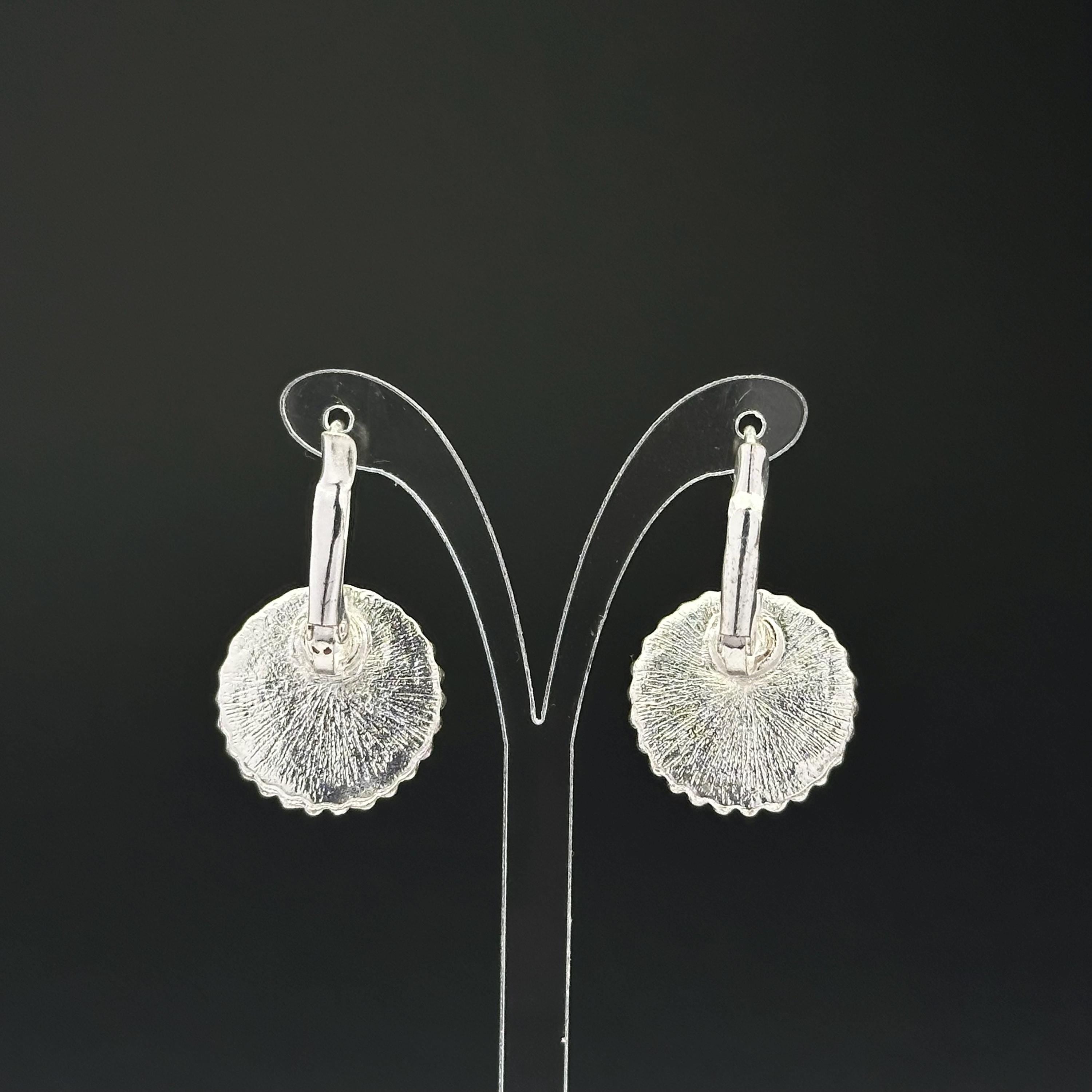 Vintage silver tone and purple plastic crystal openwork earrings