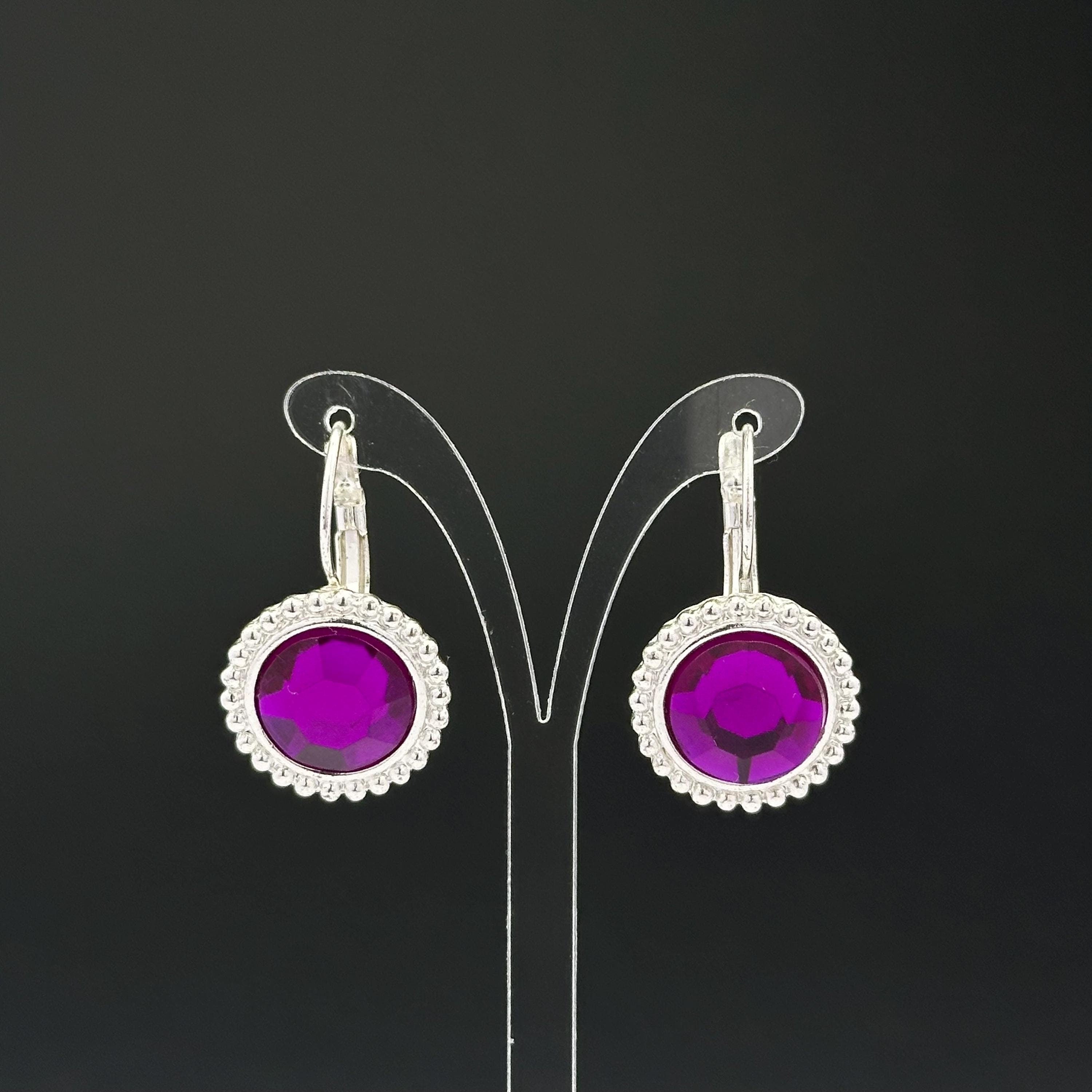 Vintage silver tone and purple plastic crystal openwork earrings