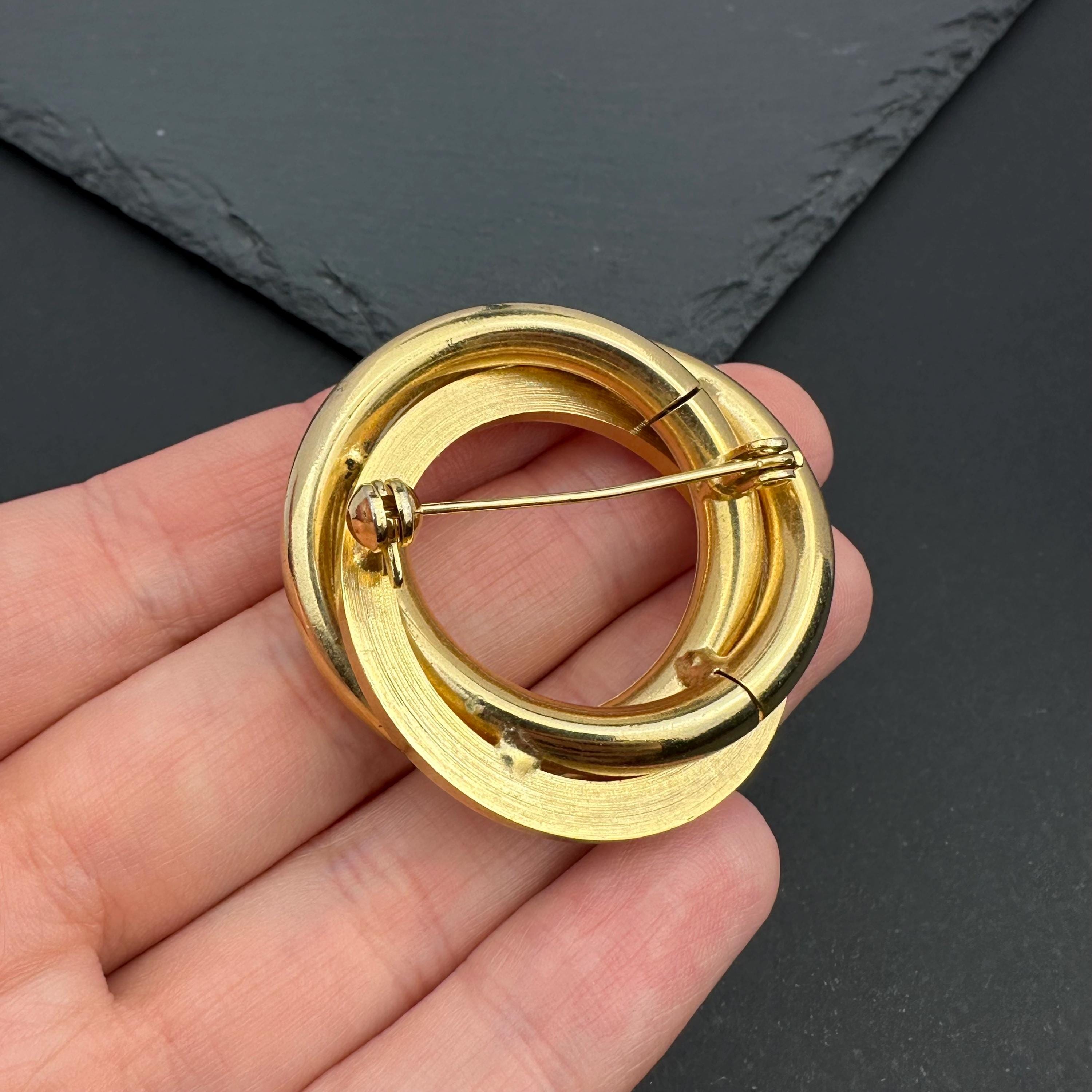 Vintage gold tone crystal interlocking circle brooch