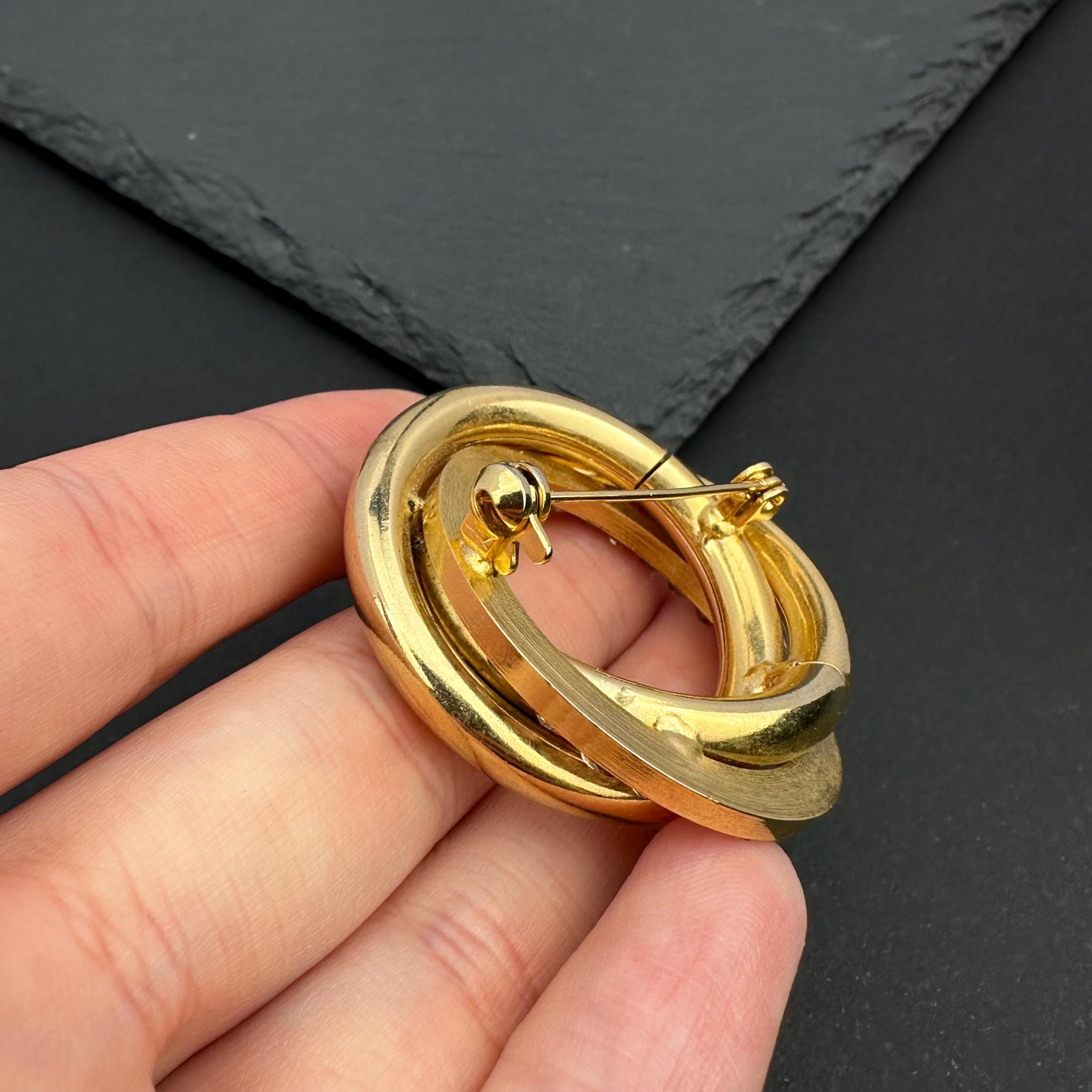 Vintage gold tone crystal interlocking circle brooch