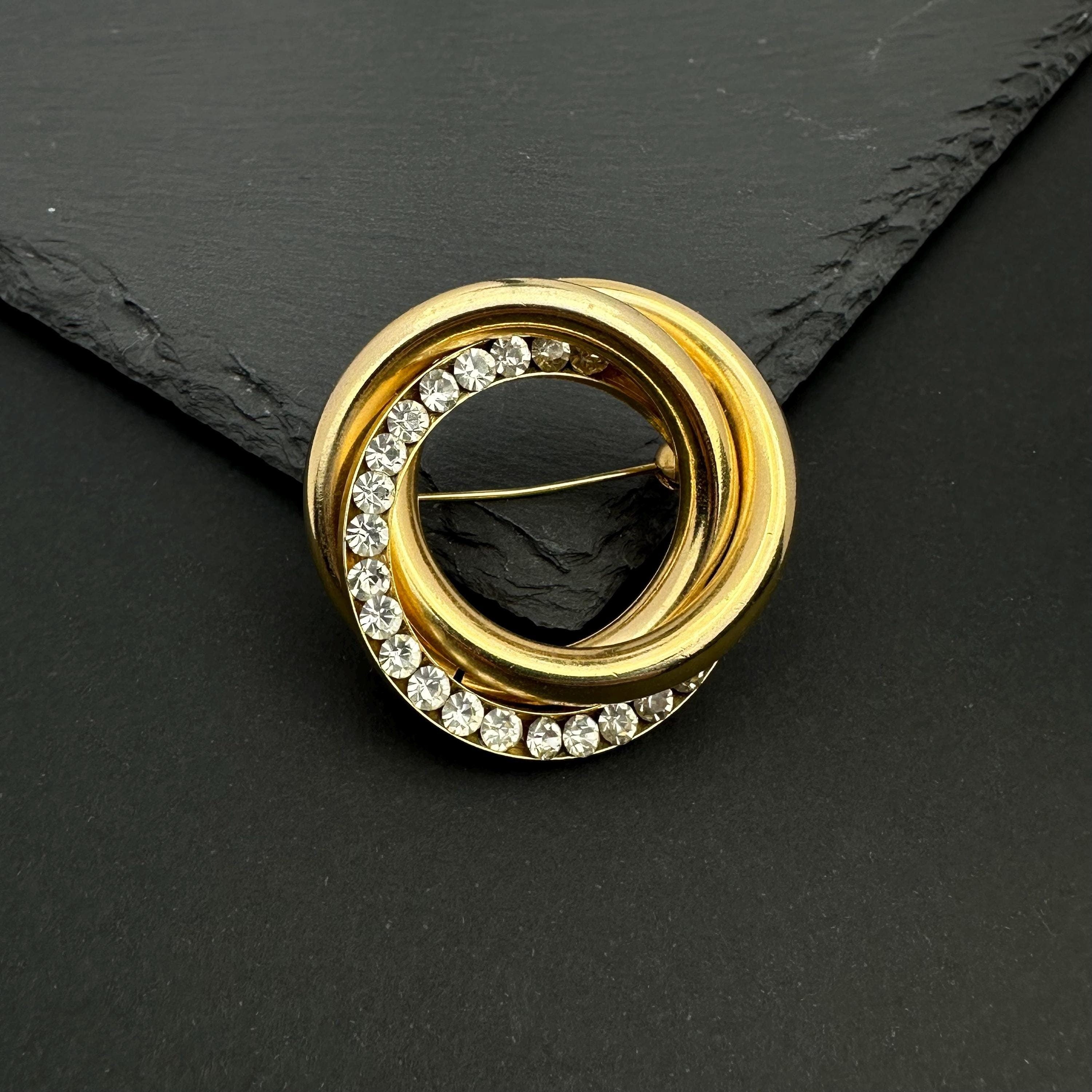 Vintage gold tone crystal interlocking circle brooch