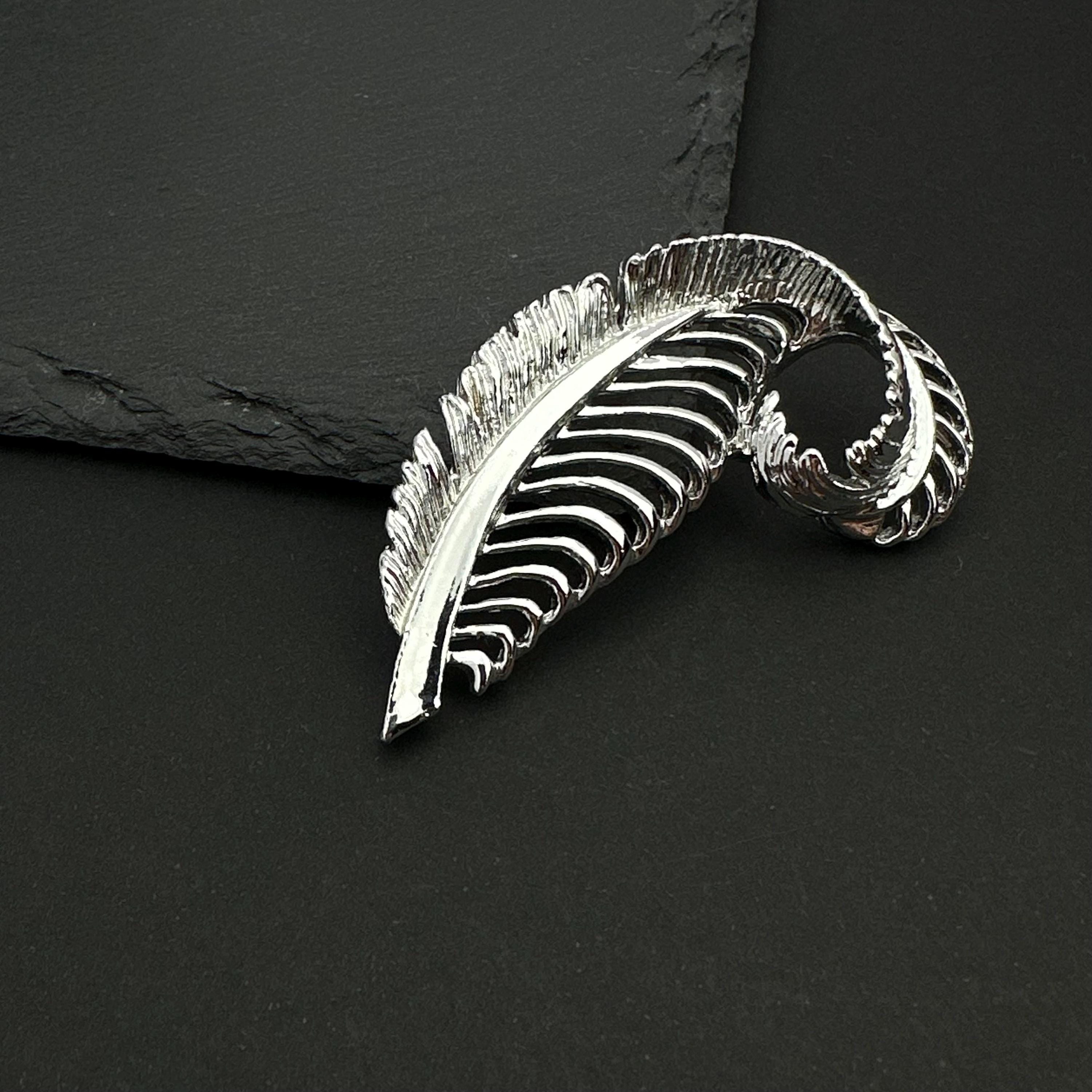 Vintage Gerry's silver tone feather brooch