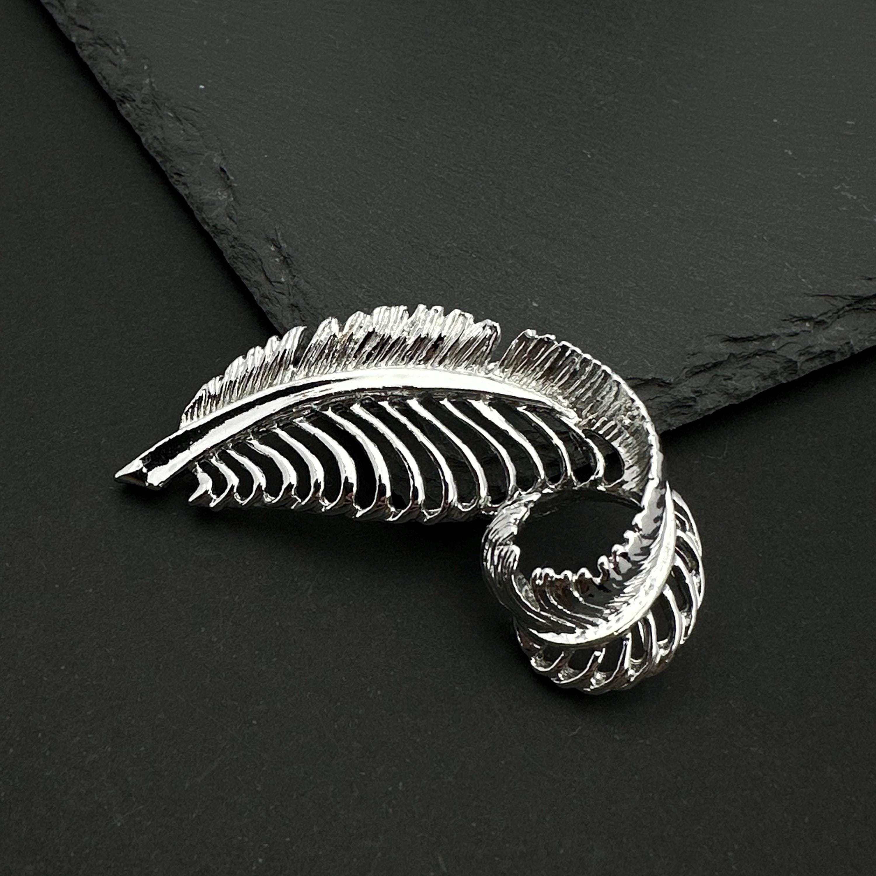 Vintage Gerry's silver tone feather brooch