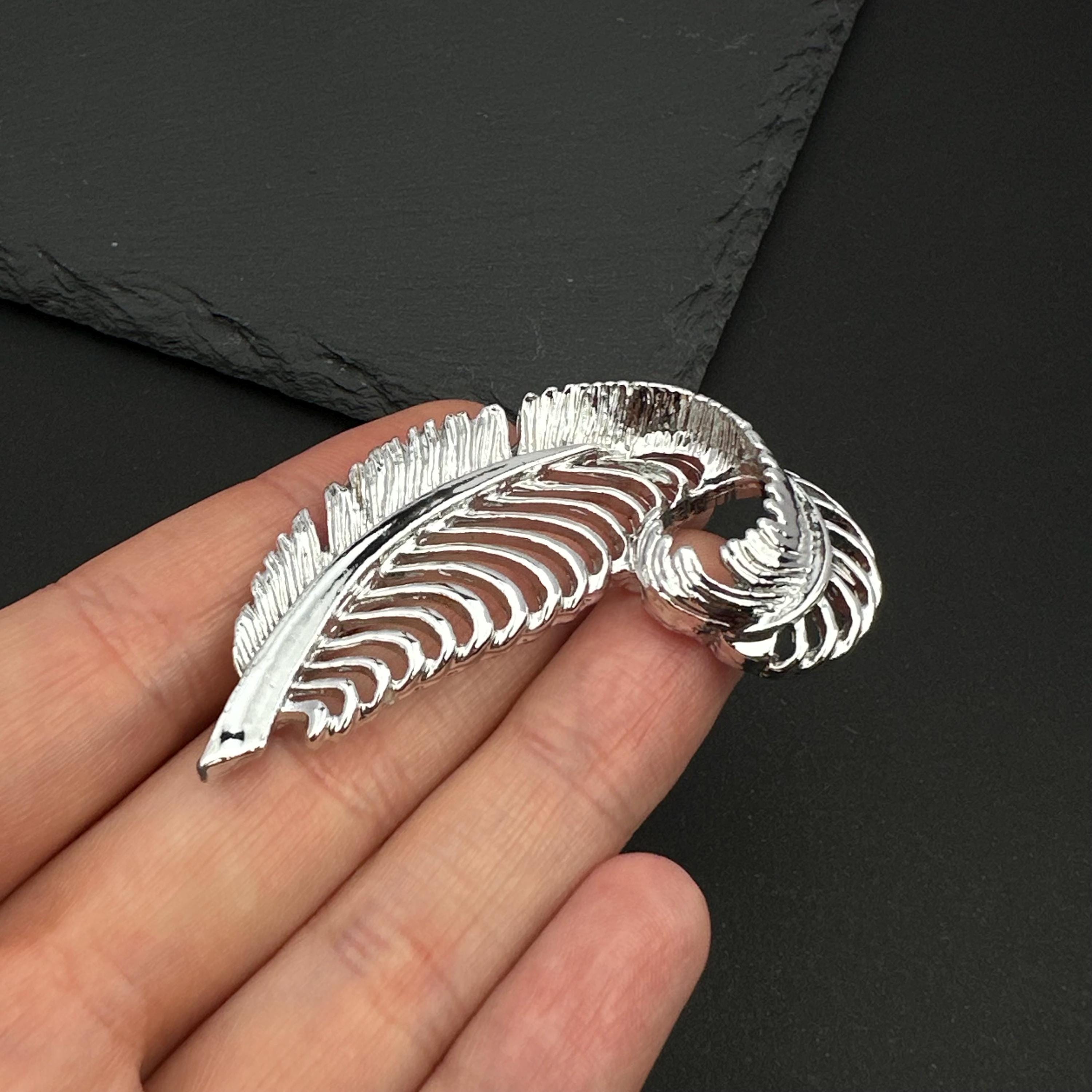 Vintage Gerry's silver tone feather brooch