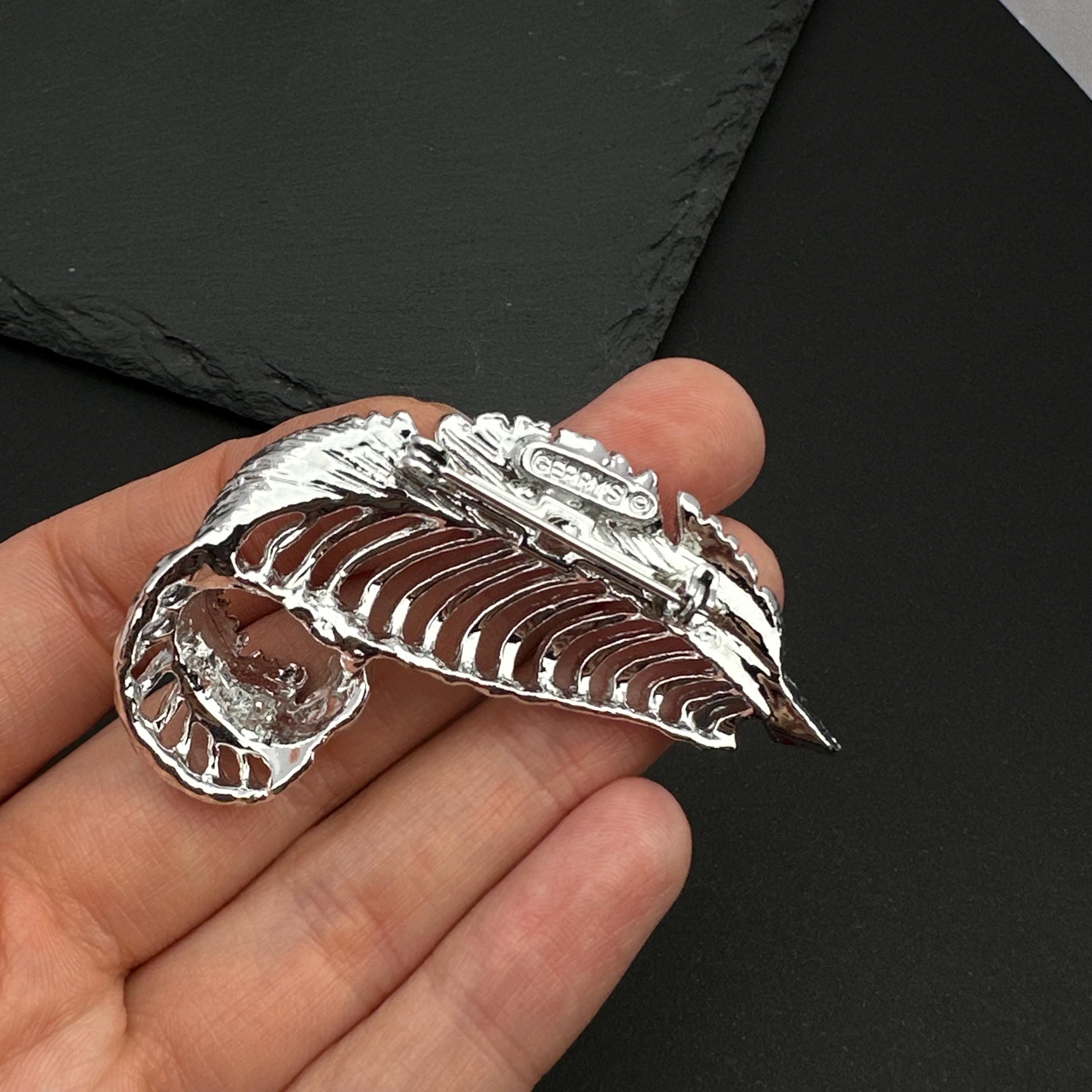 Vintage Gerry's silver tone feather brooch