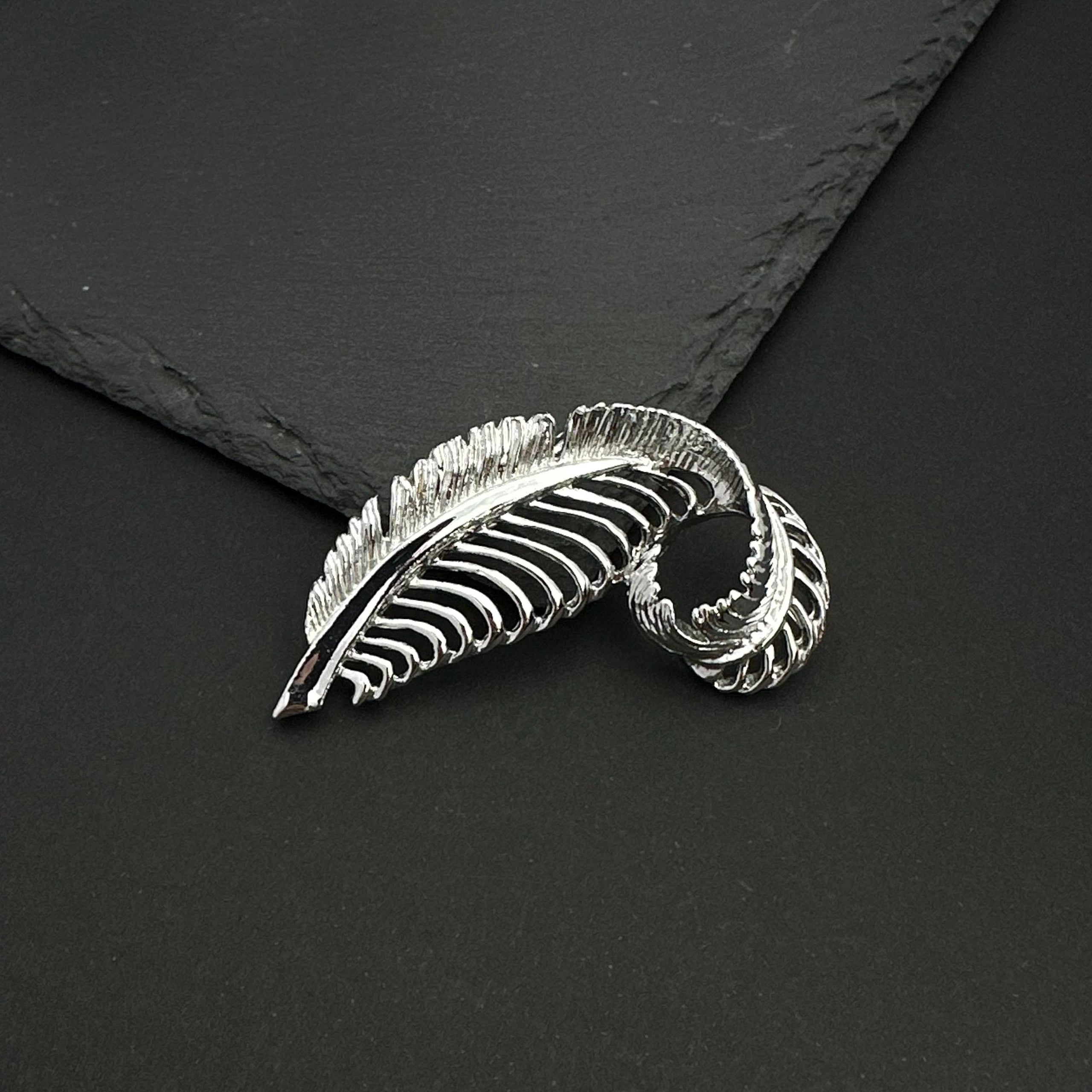 Vintage Gerry's silver tone feather brooch