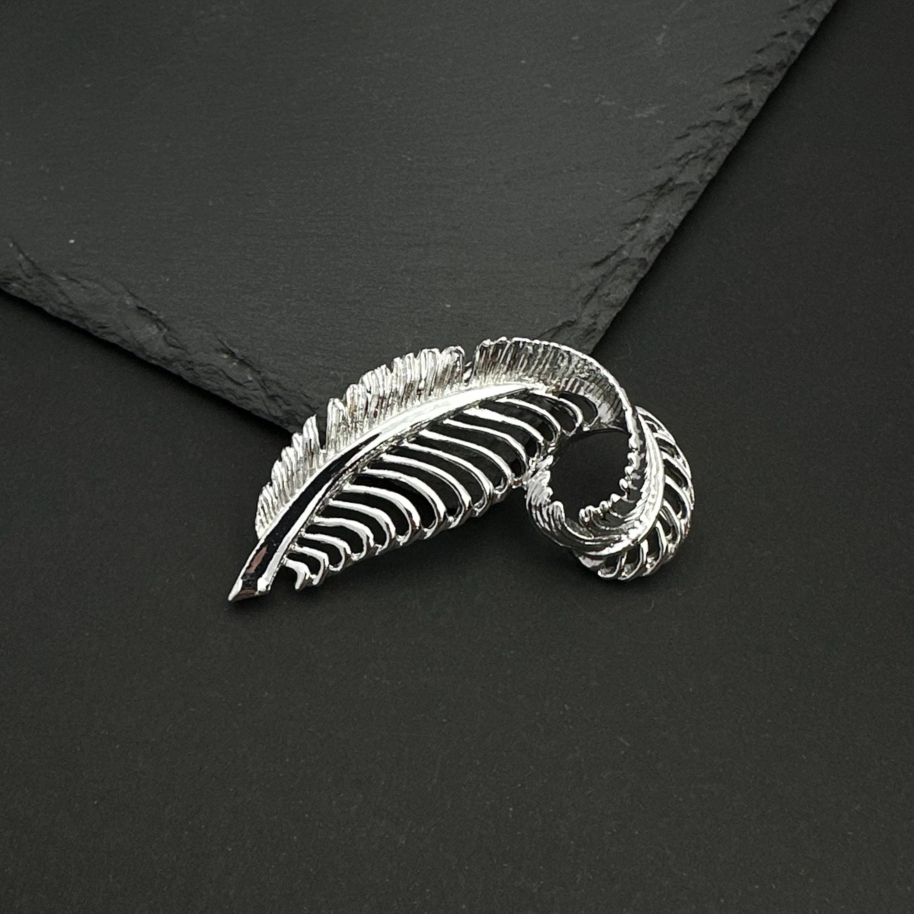 Vintage Gerry's silver tone feather brooch