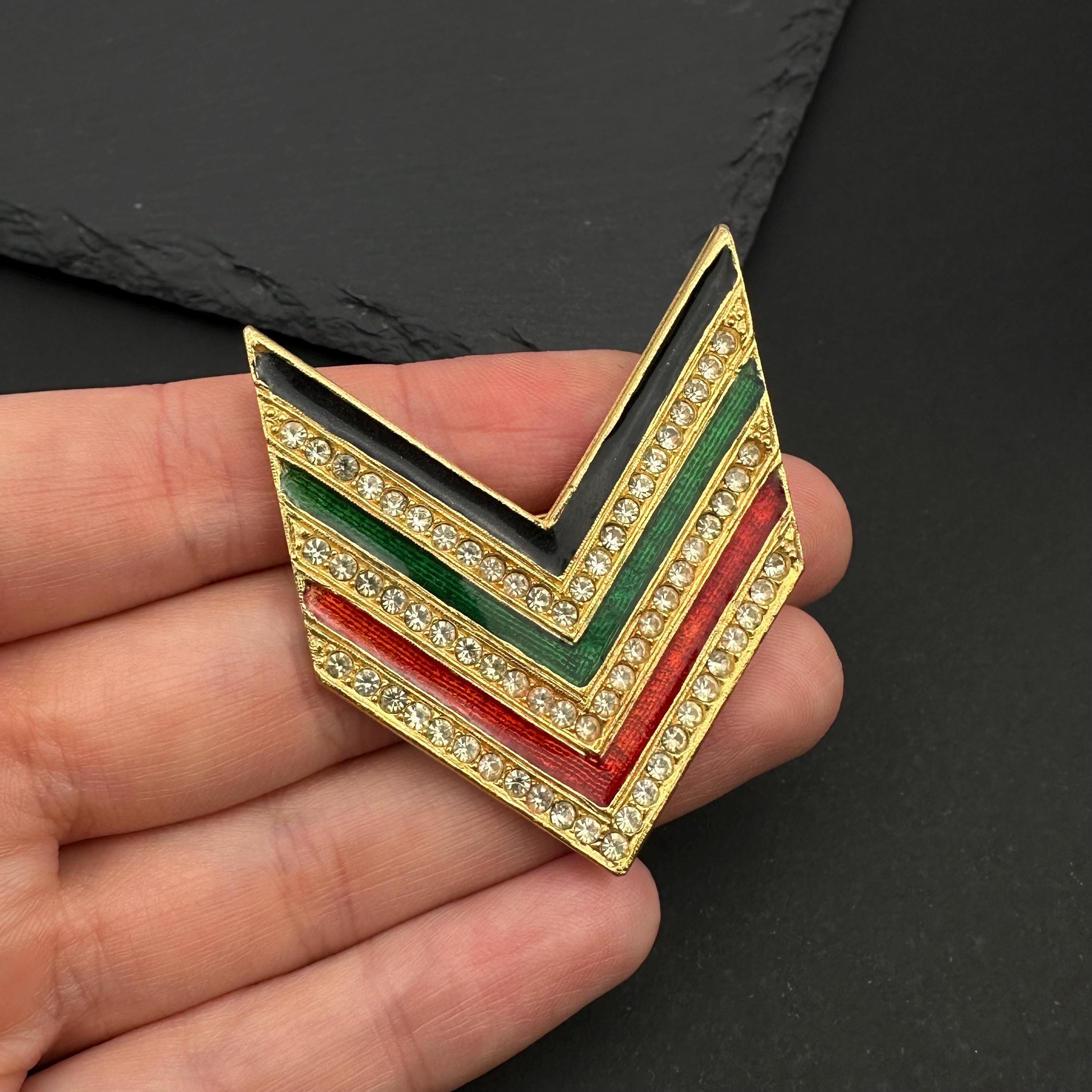 Vintage Tancer & Two gold tone, enamel and rhinestone chevron brooch