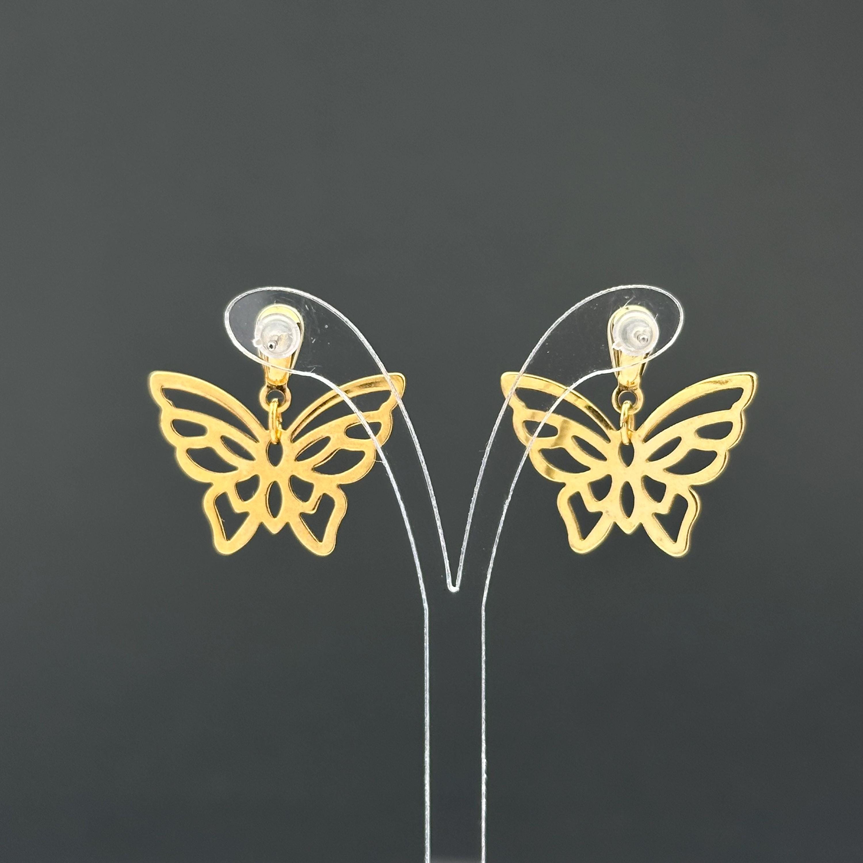 Vintage gold-tone butterfly earrings with faux pearl