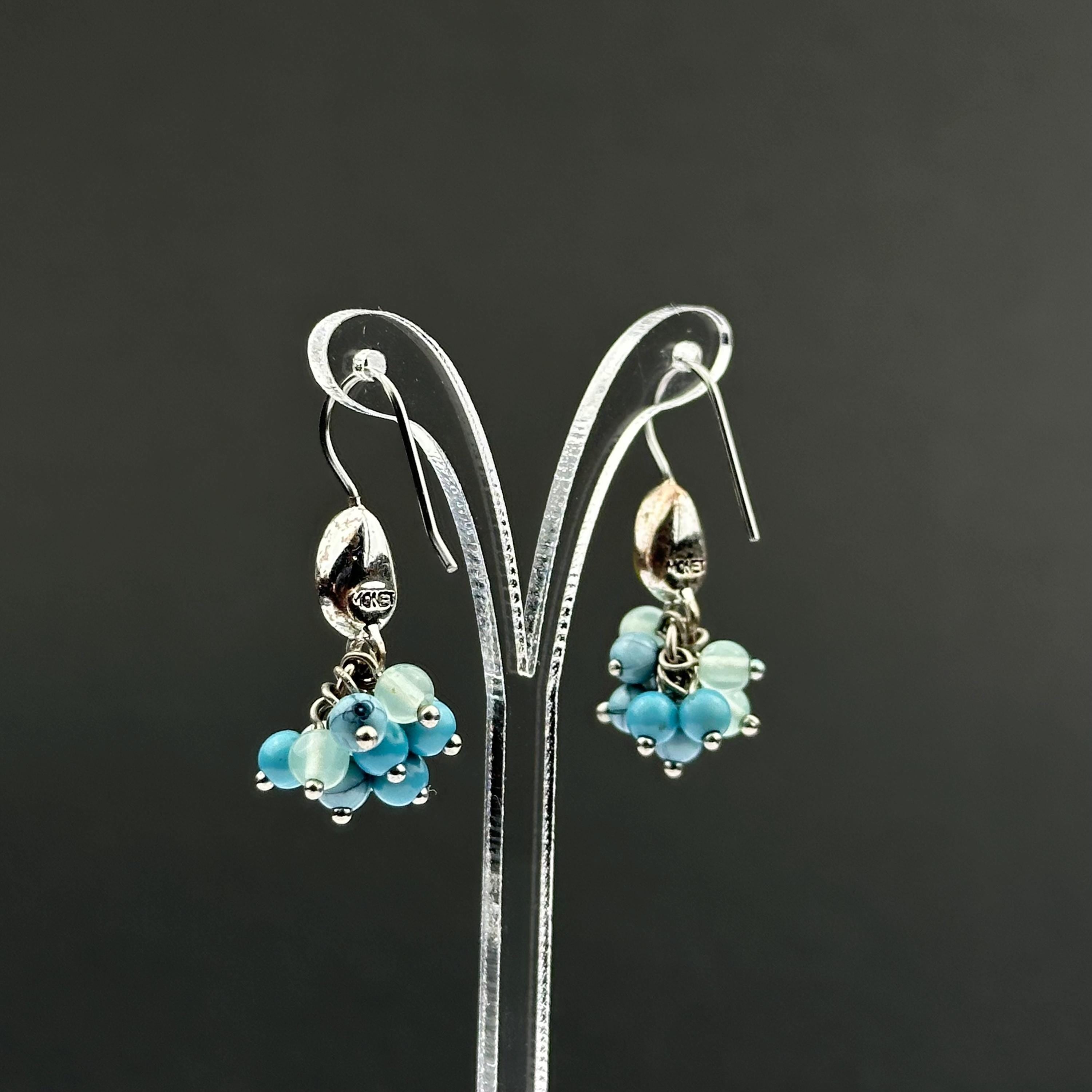Vintage Monet drop earrings with green and blue bead