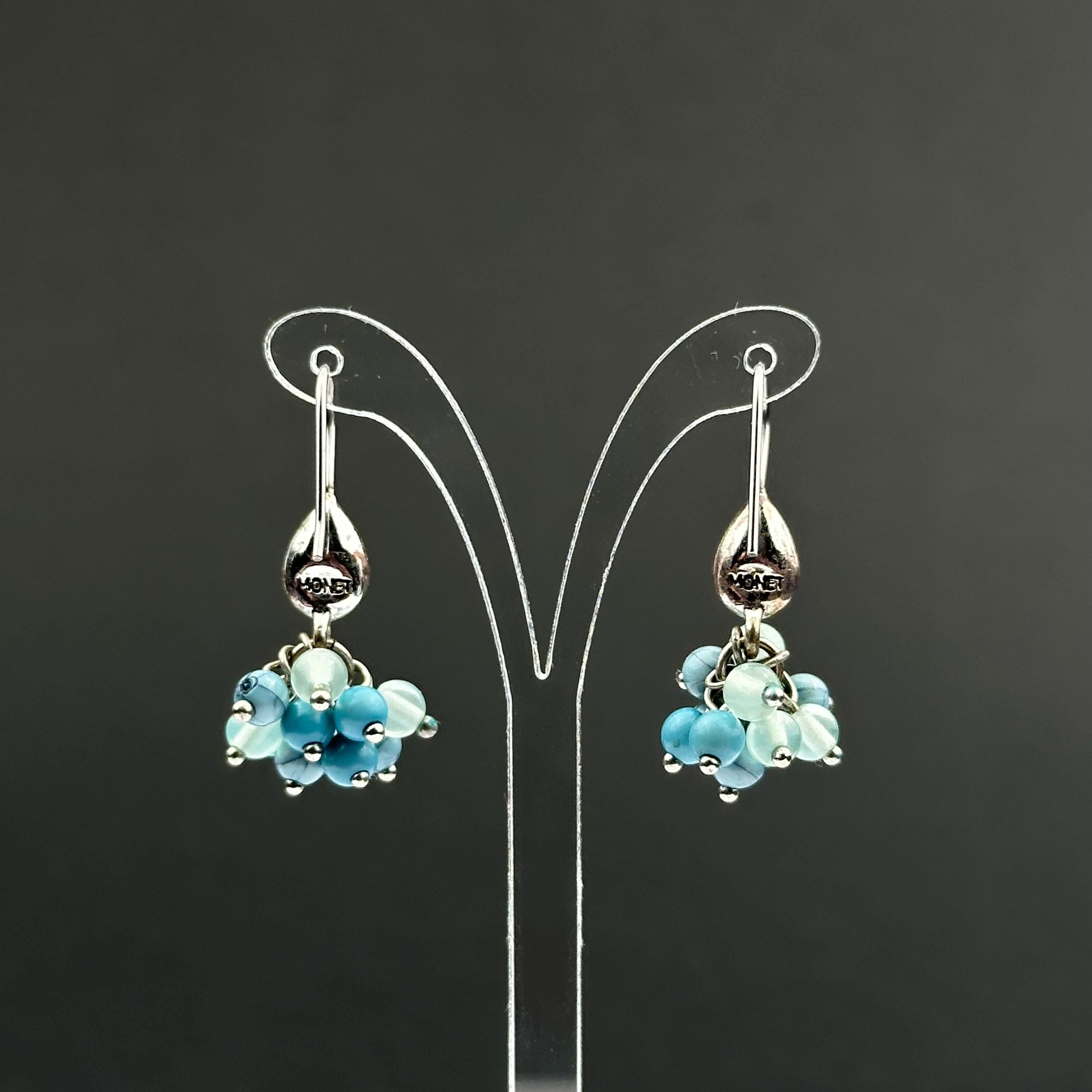 Vintage Monet drop earrings with green and blue bead