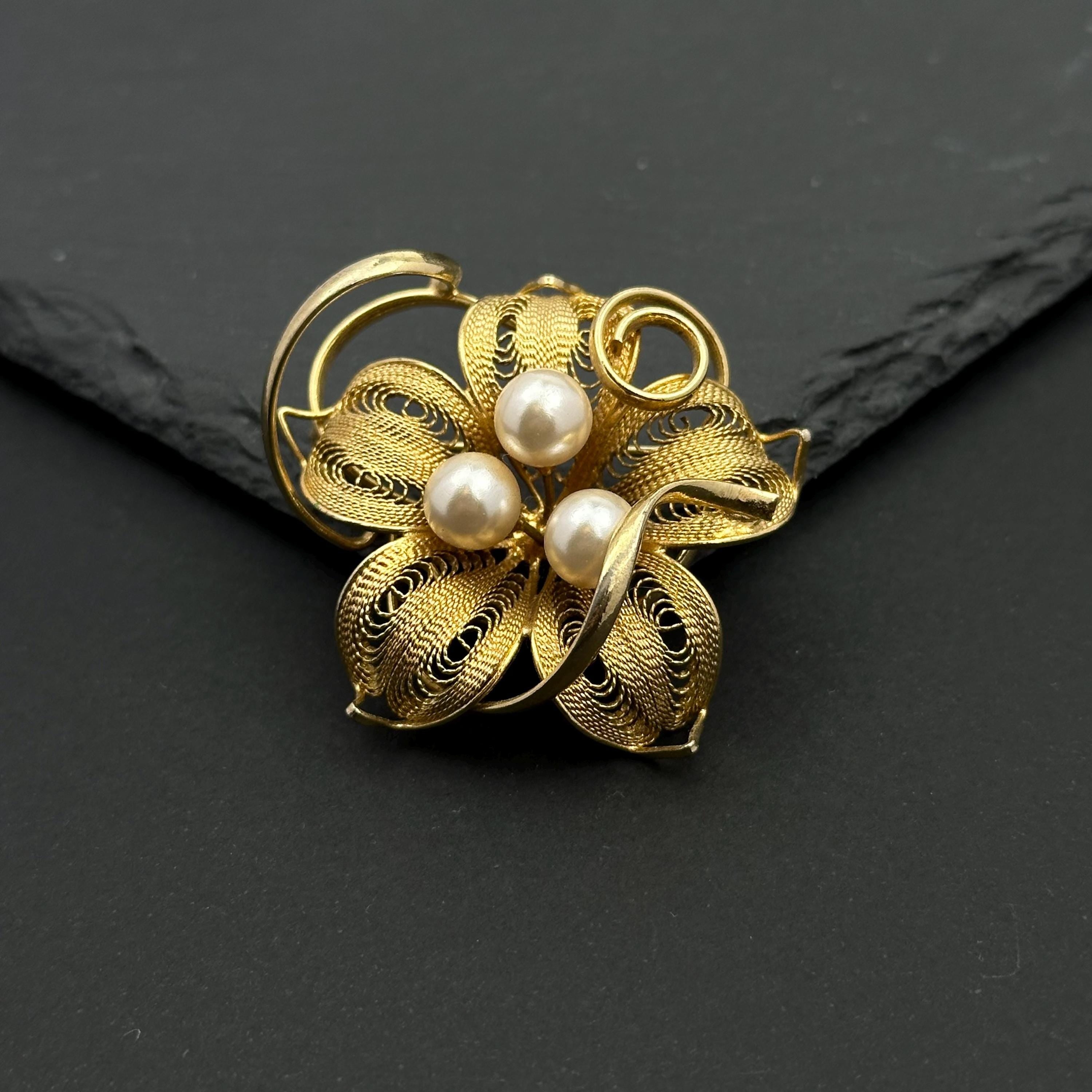 Vintage gold tone and pearl flower filigree brooch