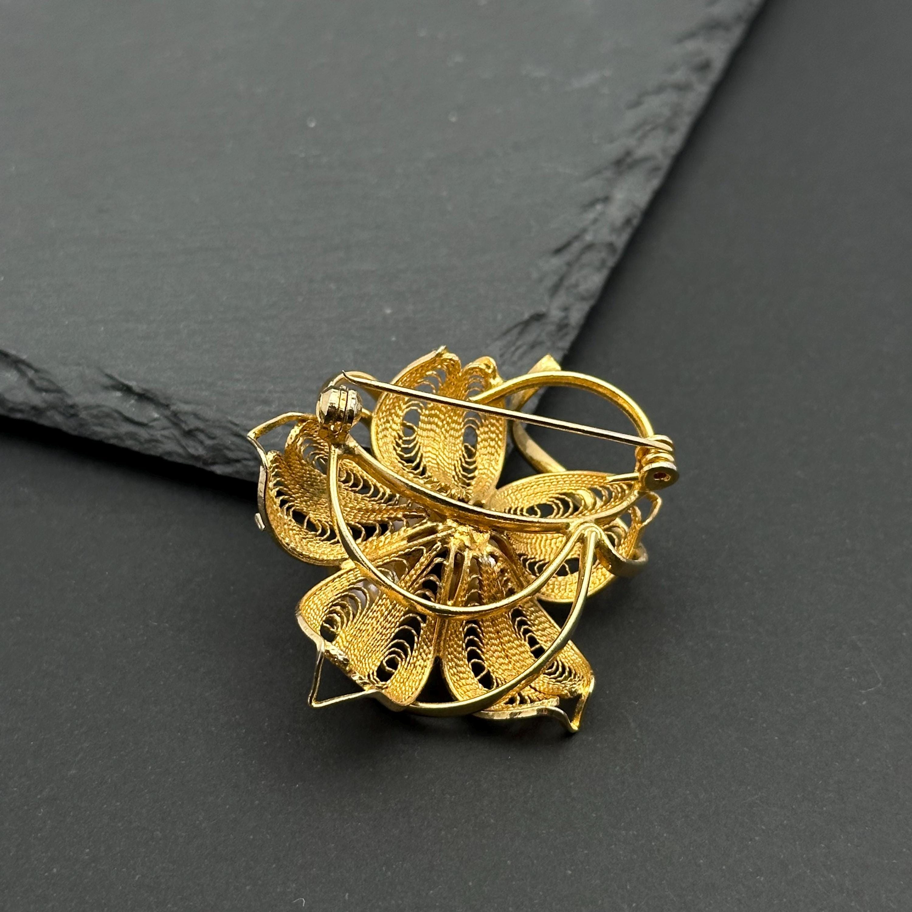 Vintage gold tone and pearl flower filigree brooch