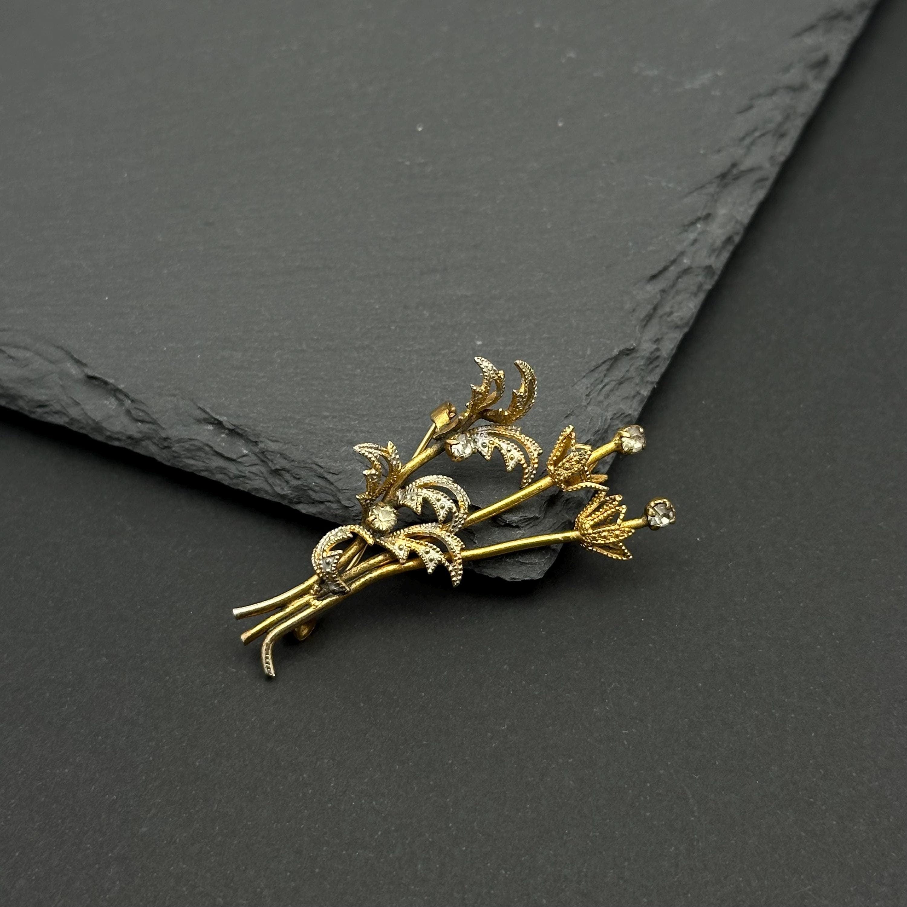 Vintage gold tone and crystal bouquet brooch