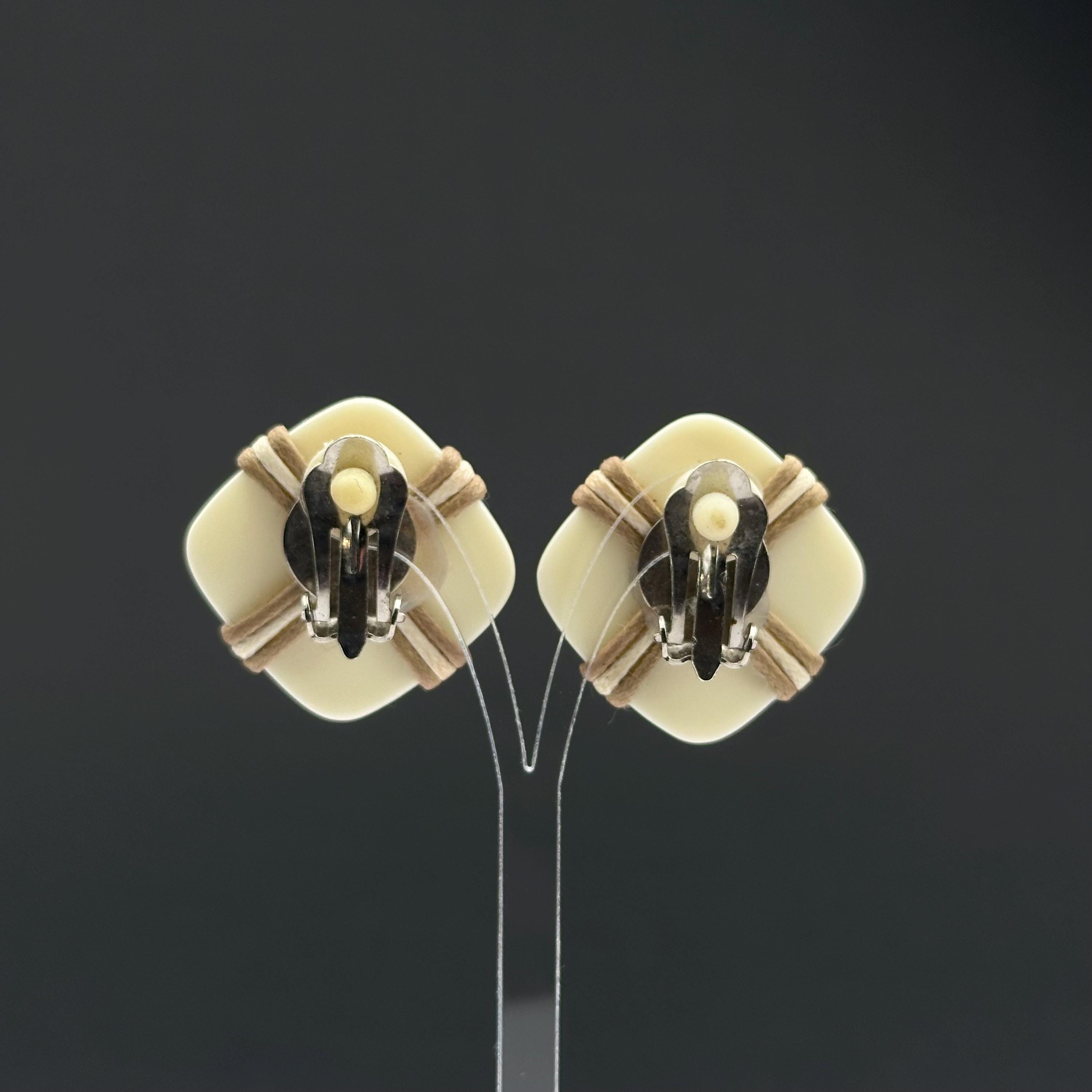 Vintage white plastic geometric clip on earrings