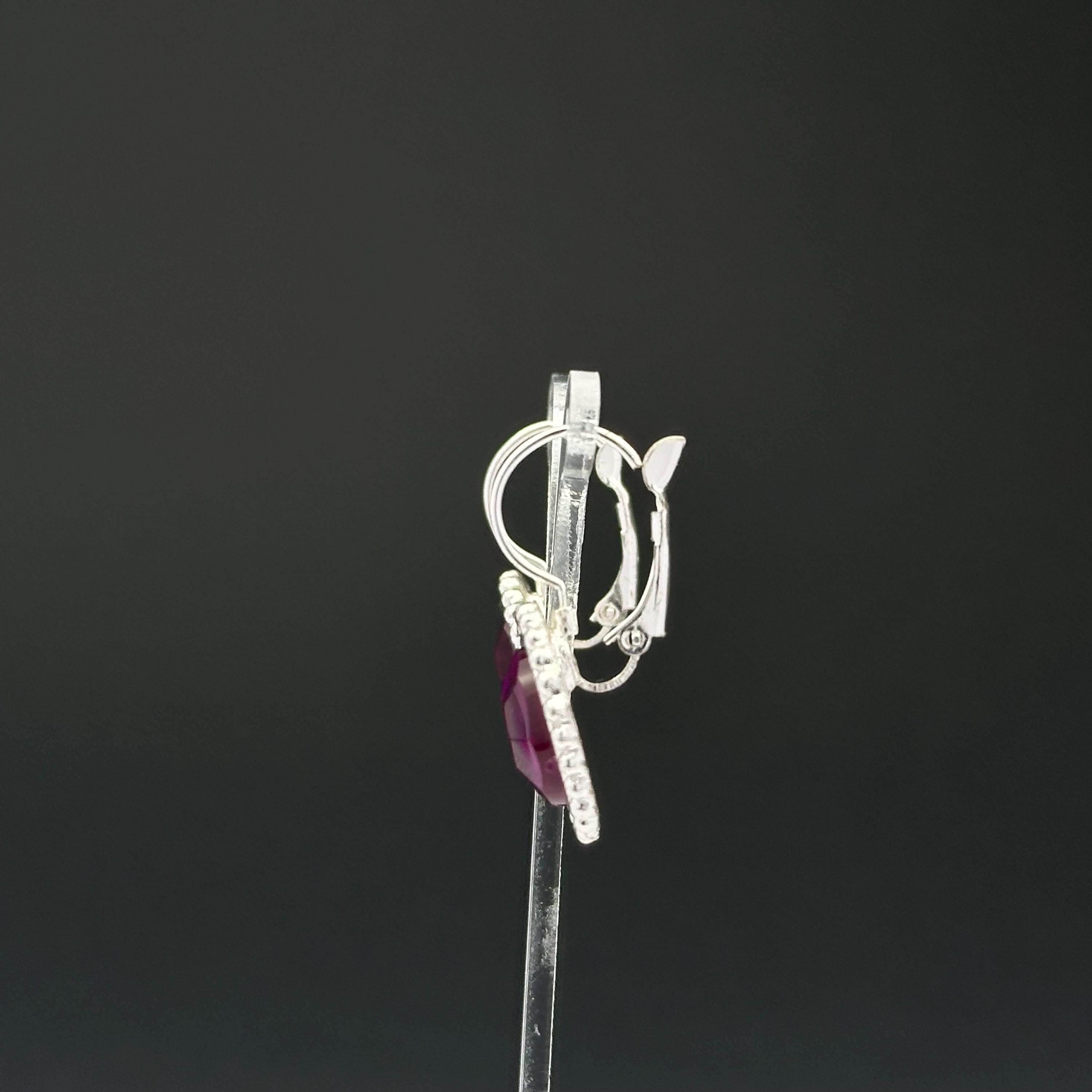 Vintage silver tone and purple plastic crystal openwork earrings