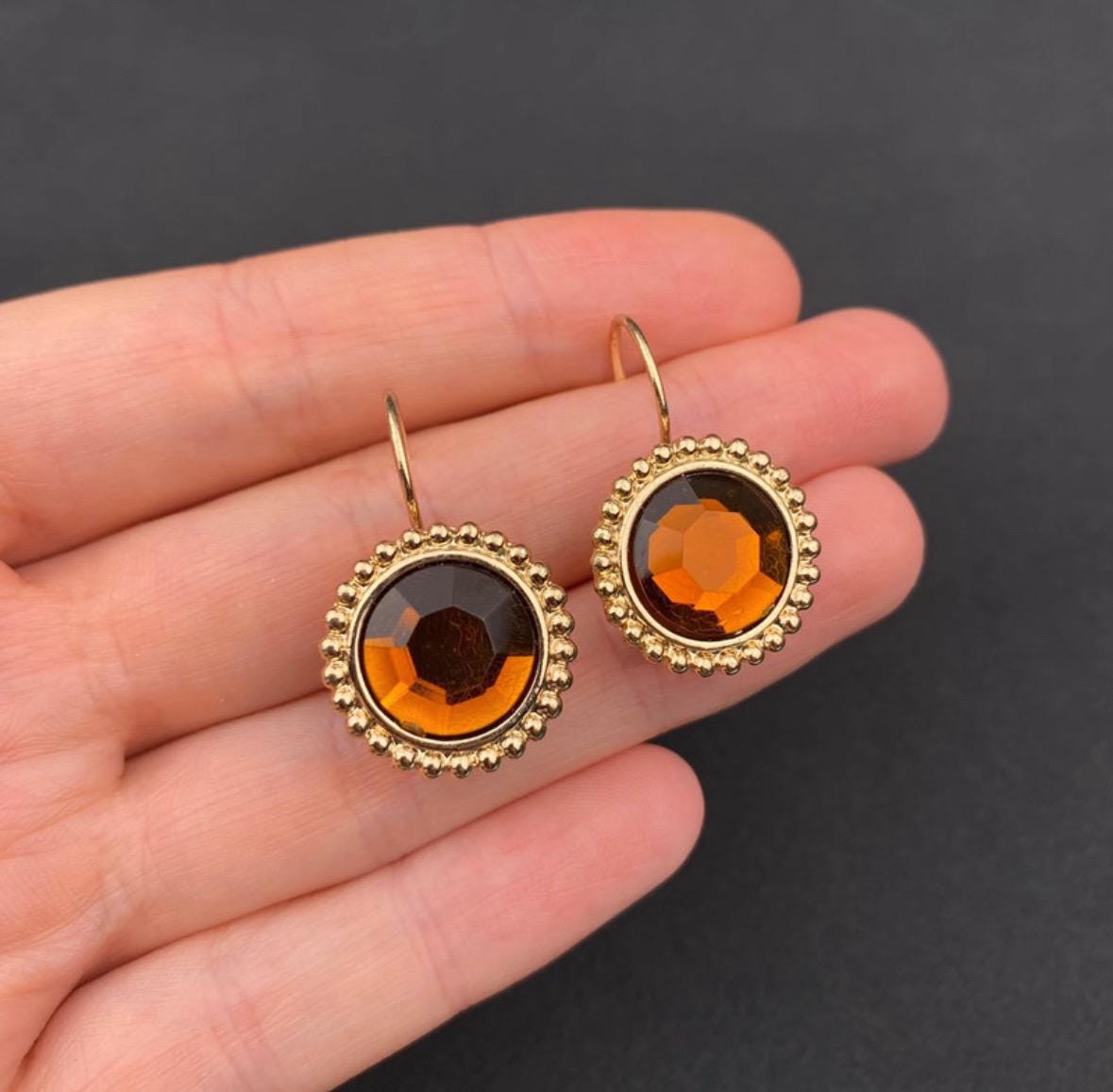 Vintage gold tone and brown plastic crystal openwork earrings