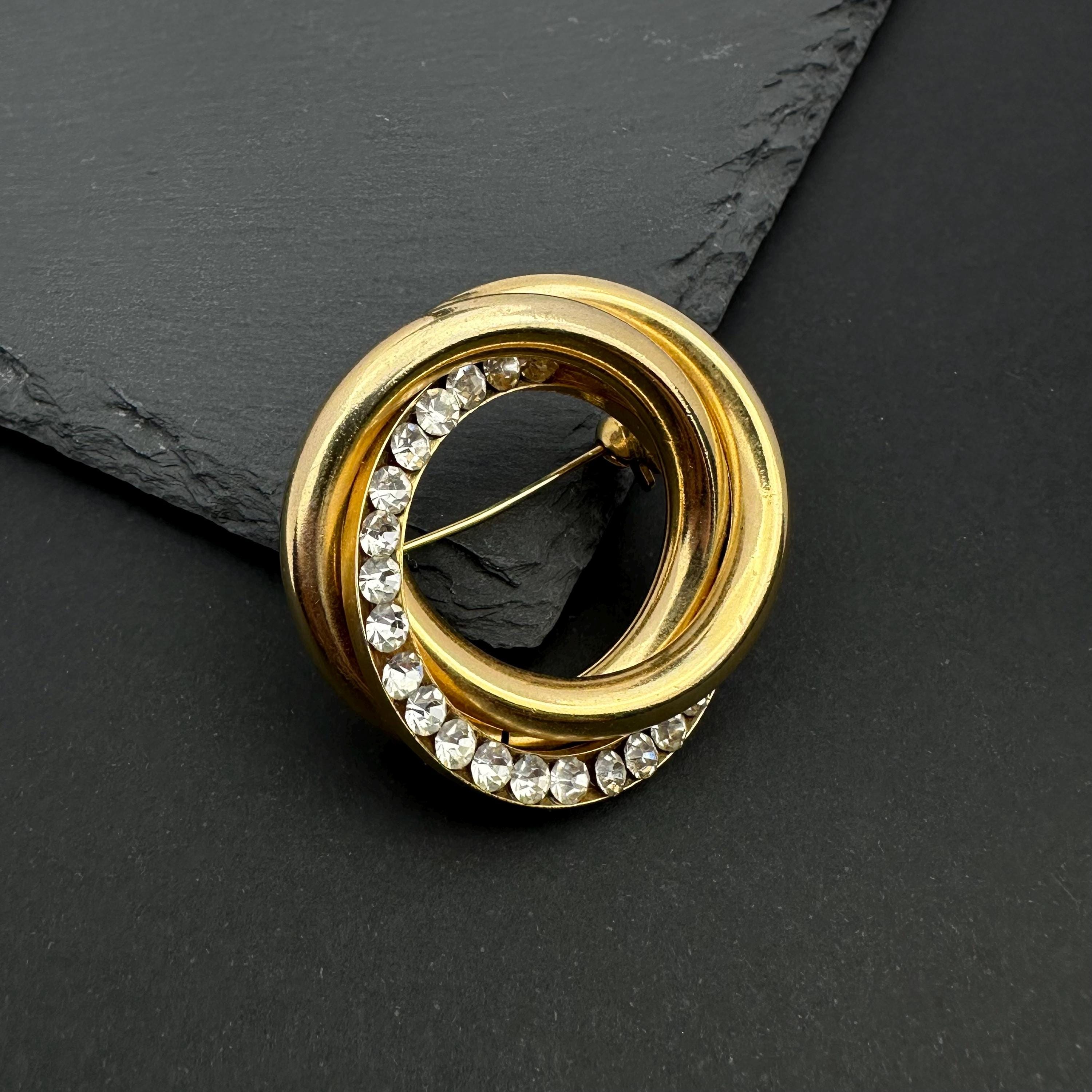 Vintage gold tone crystal interlocking circle brooch