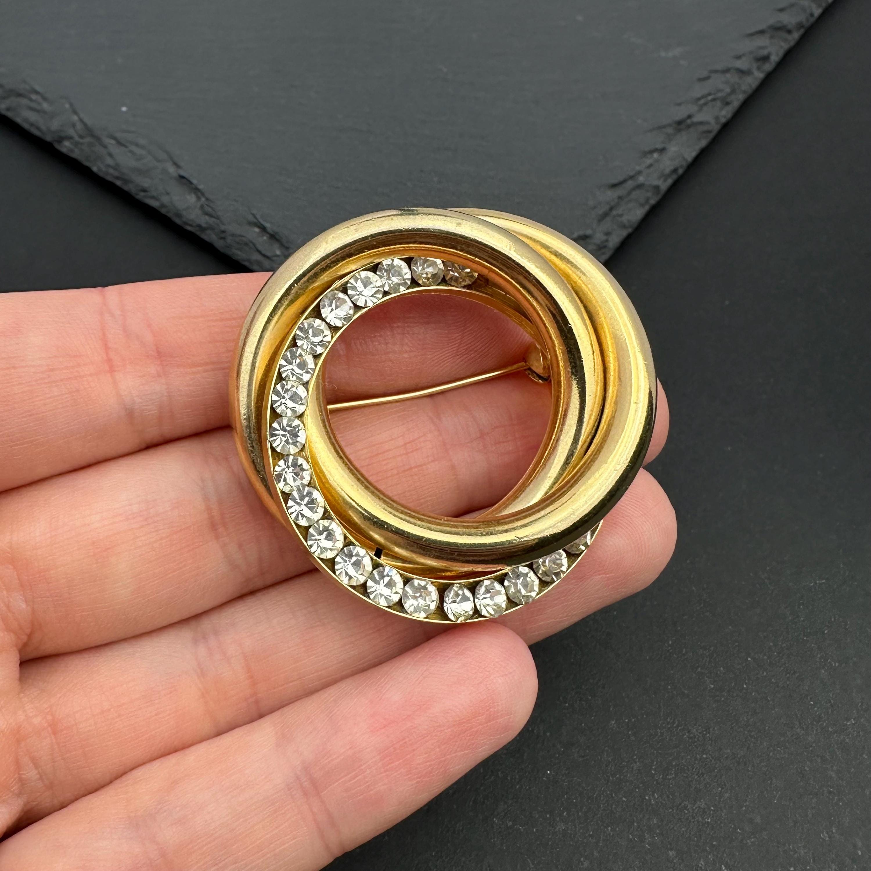 Vintage gold tone crystal interlocking circle brooch
