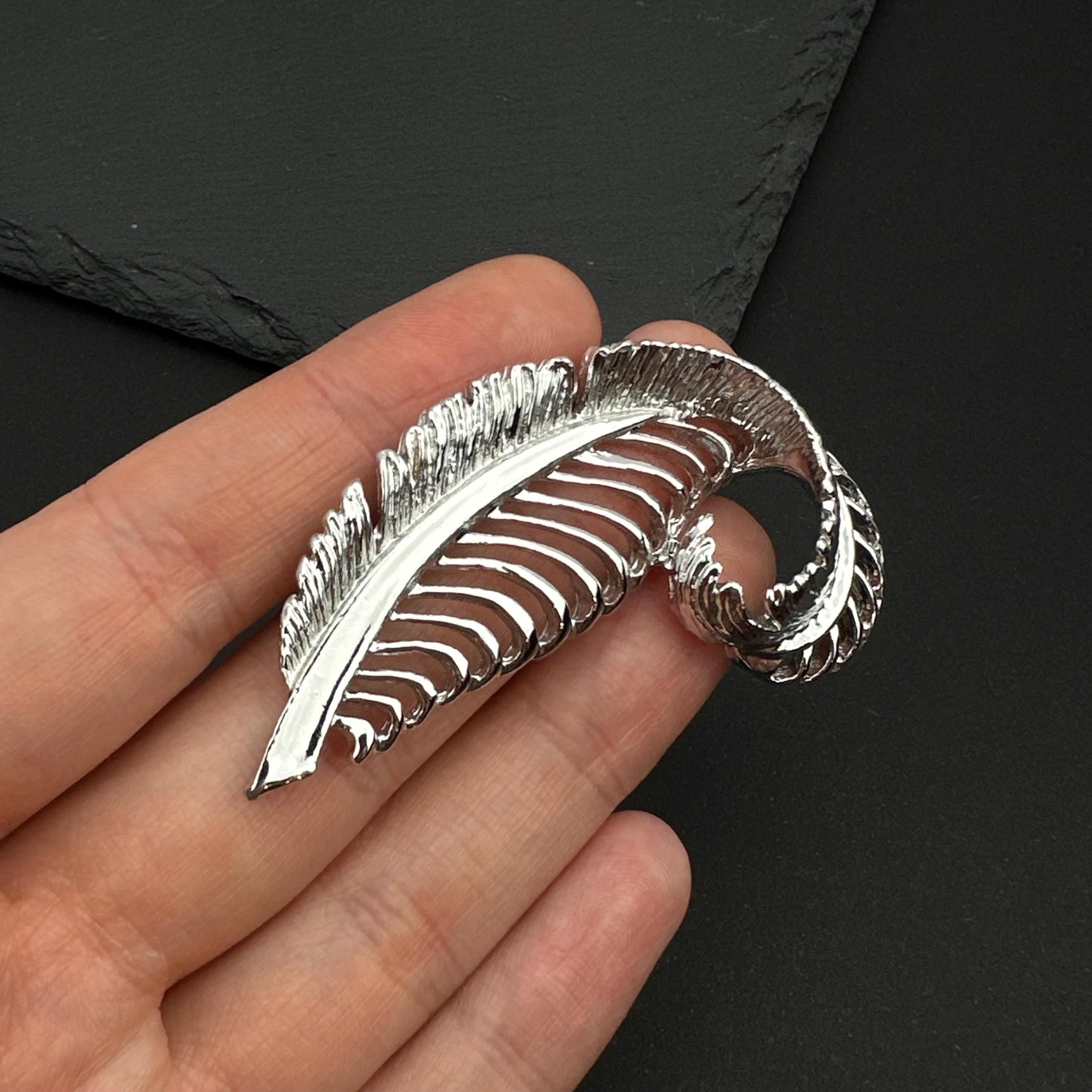Vintage Gerry's silver tone feather brooch