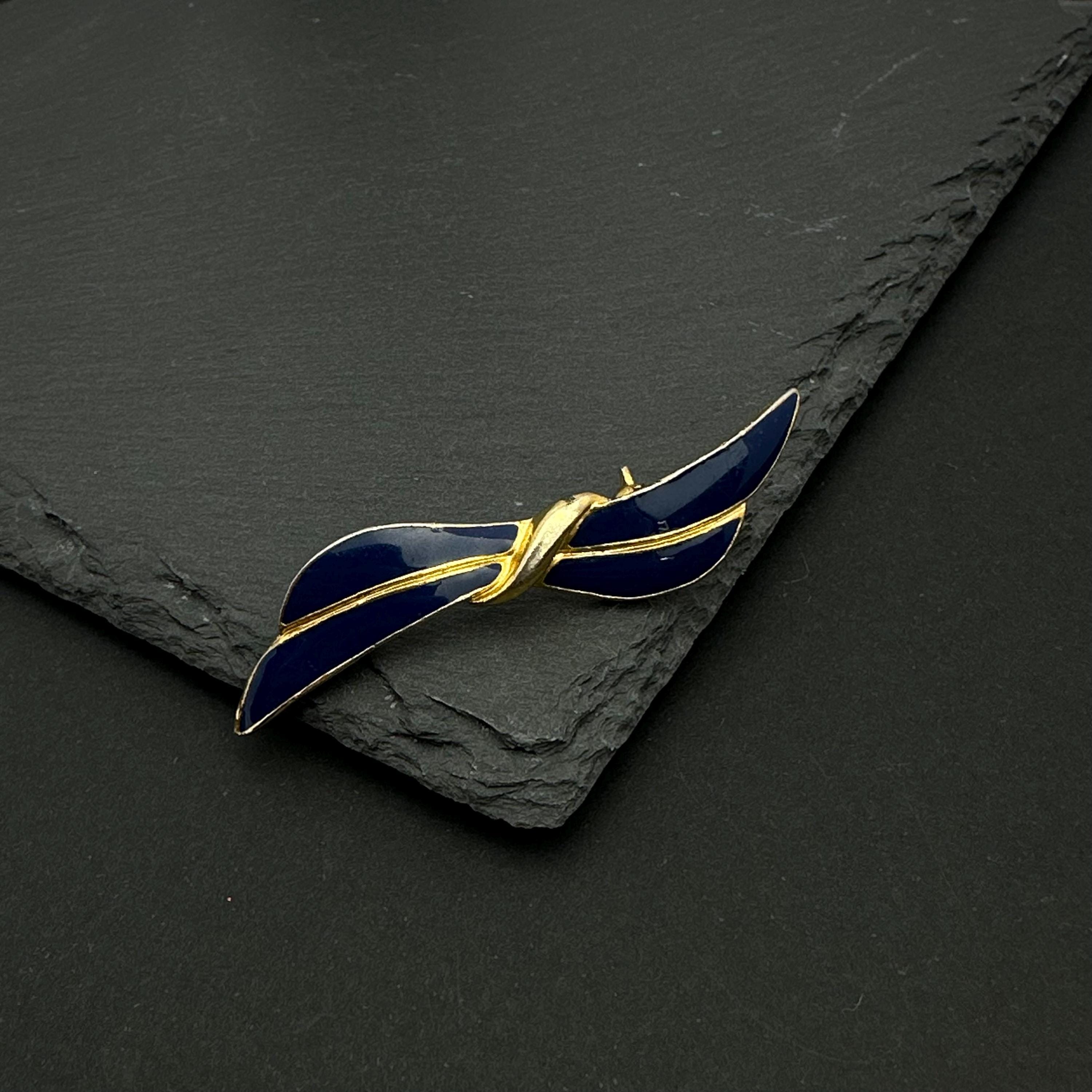 Vintage gold tone and navy enamel bow brooch