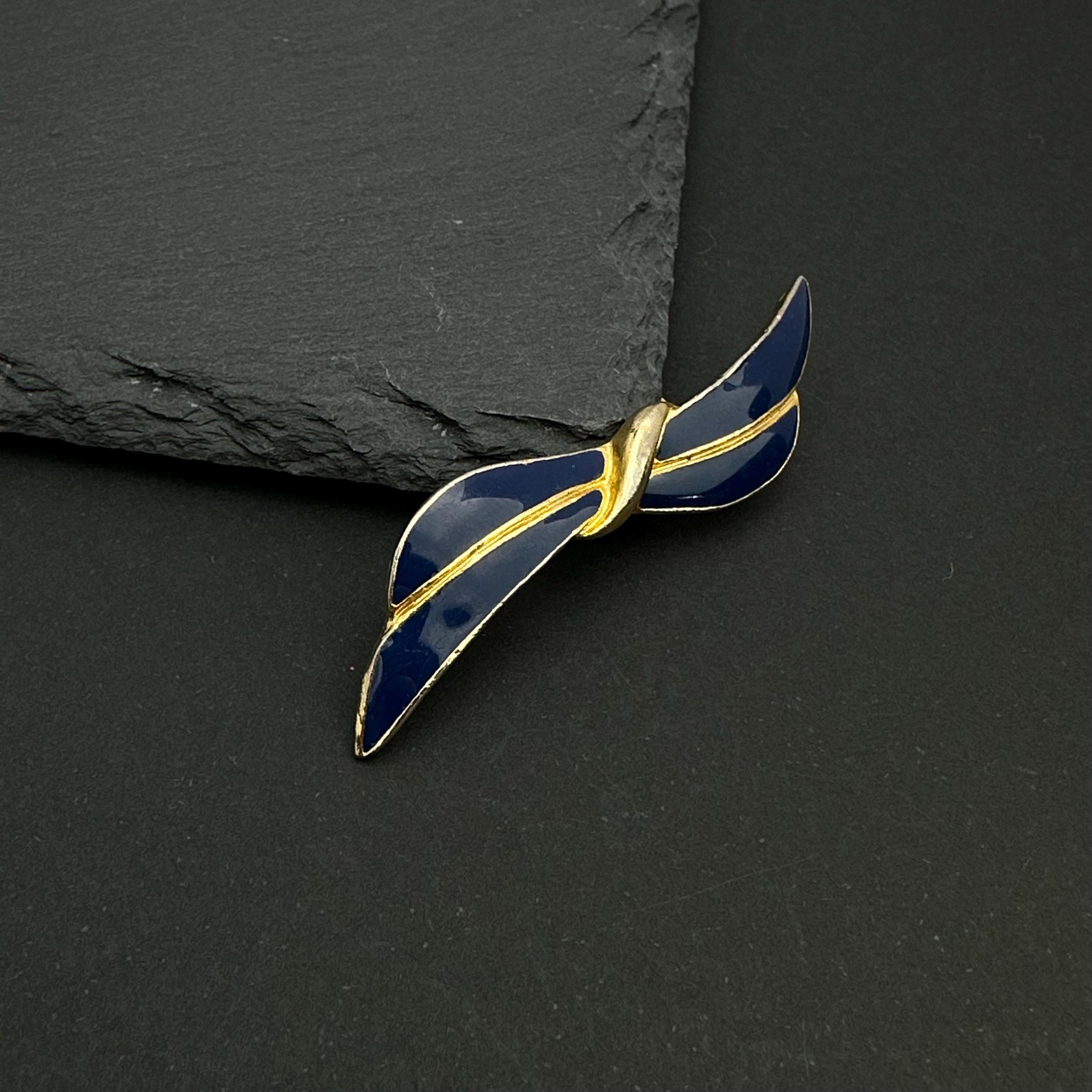 Vintage gold tone and navy enamel bow brooch