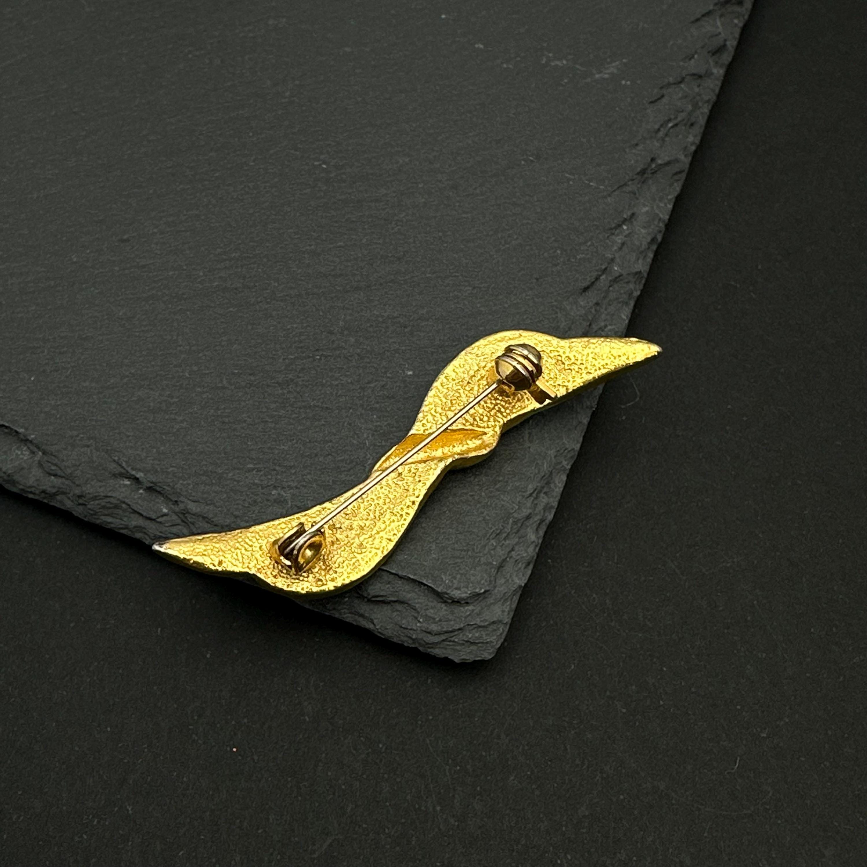 Vintage gold tone and navy enamel bow brooch