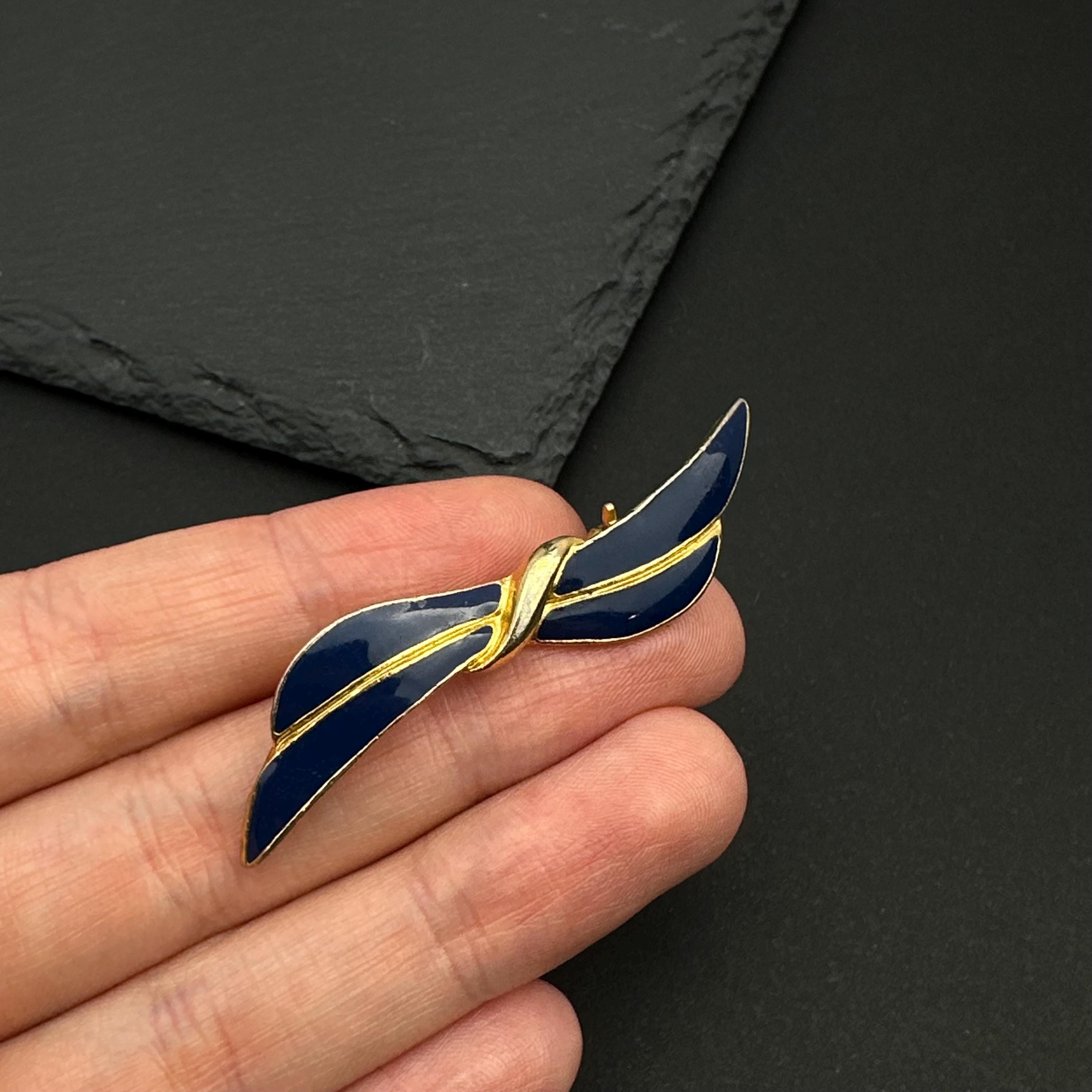 Vintage gold tone and navy enamel bow brooch