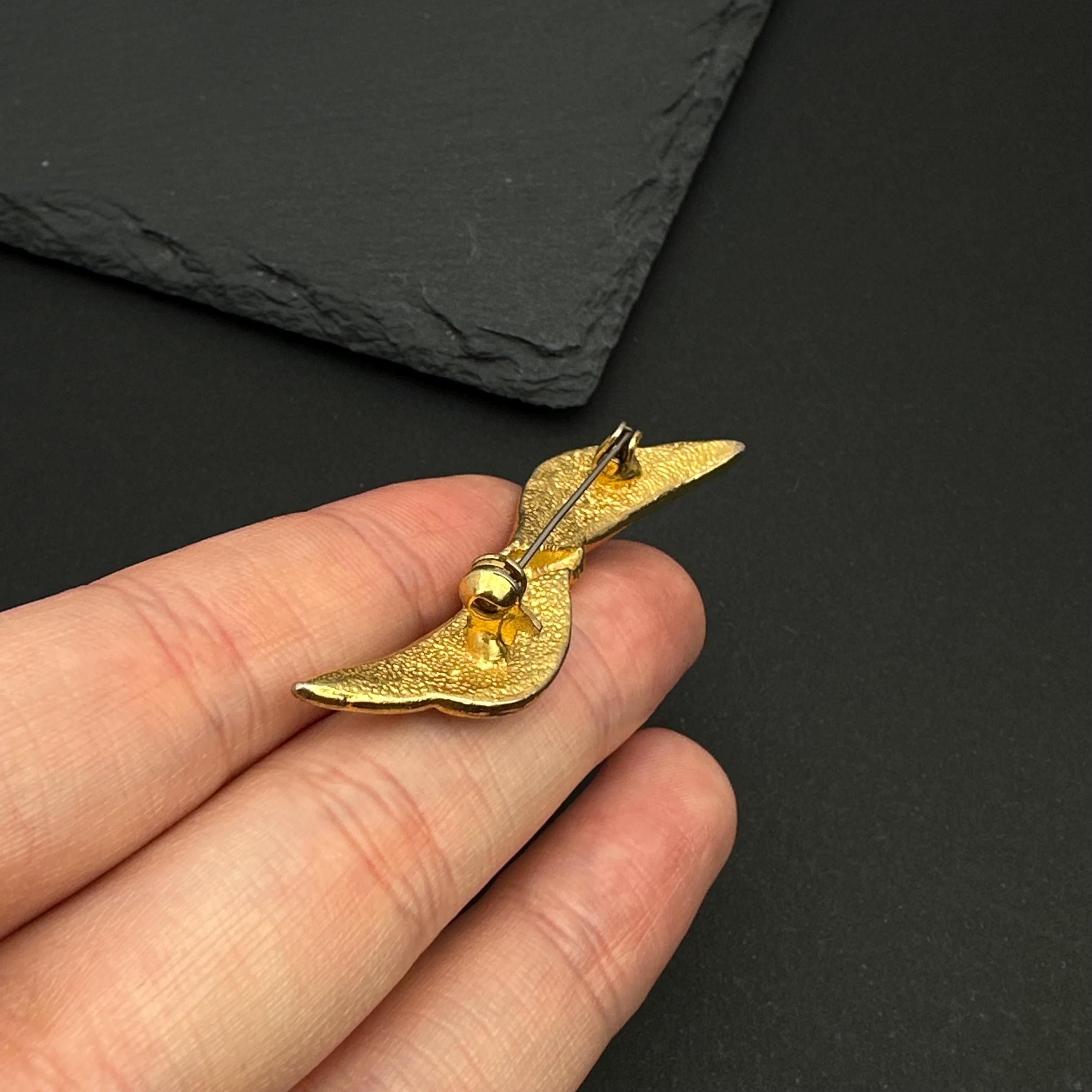 Vintage gold tone and navy enamel bow brooch