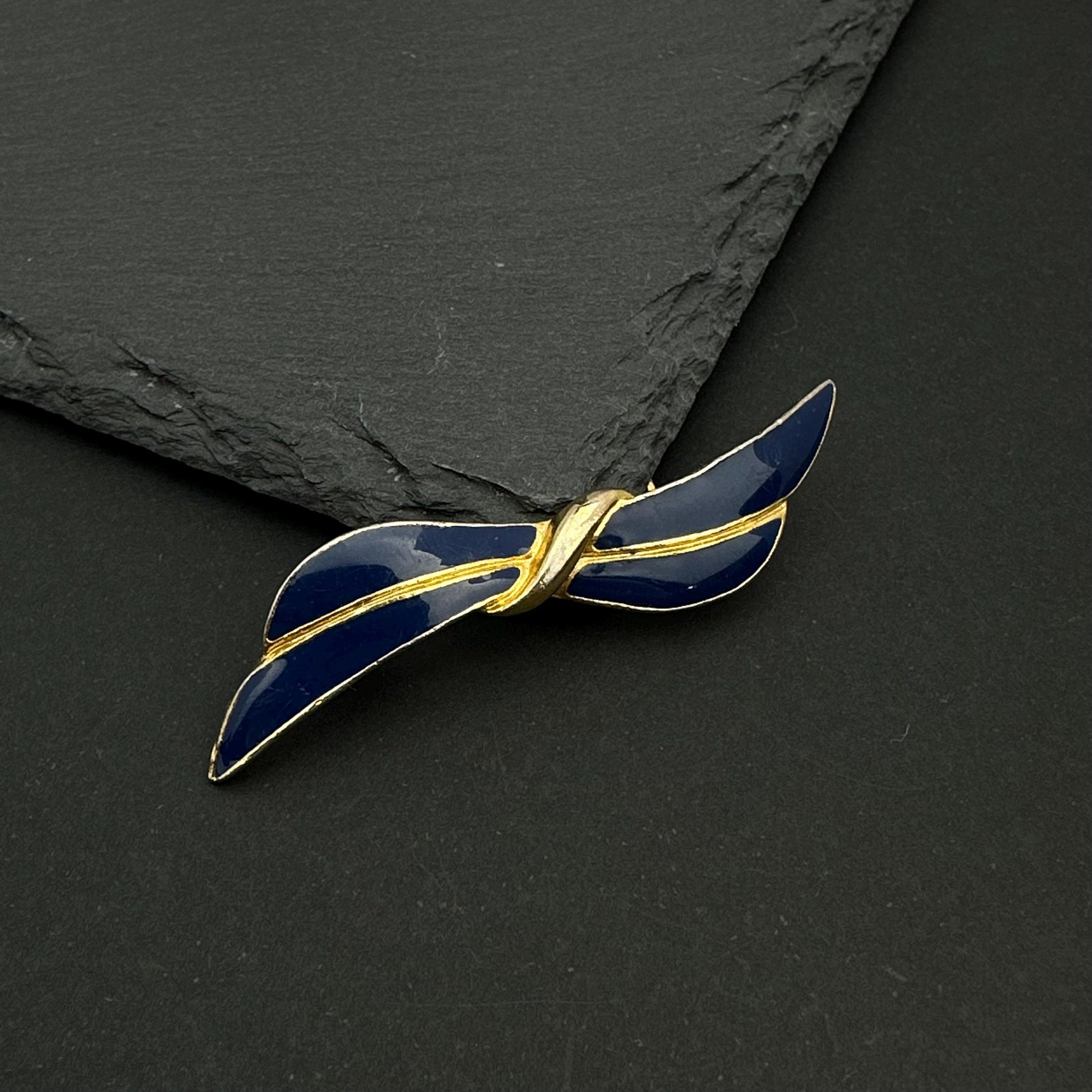 Vintage gold tone and navy enamel bow brooch