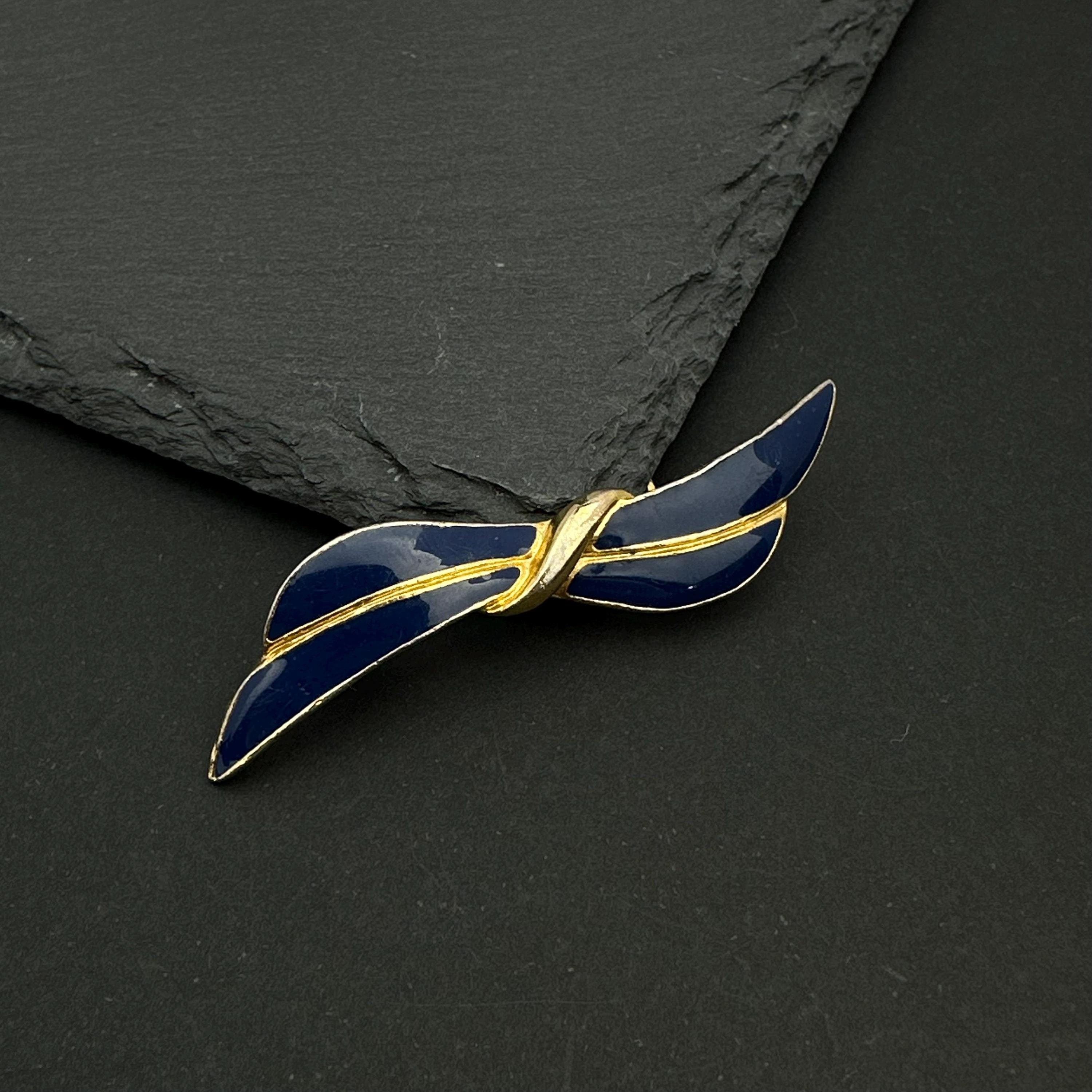 Vintage gold tone and navy enamel bow brooch