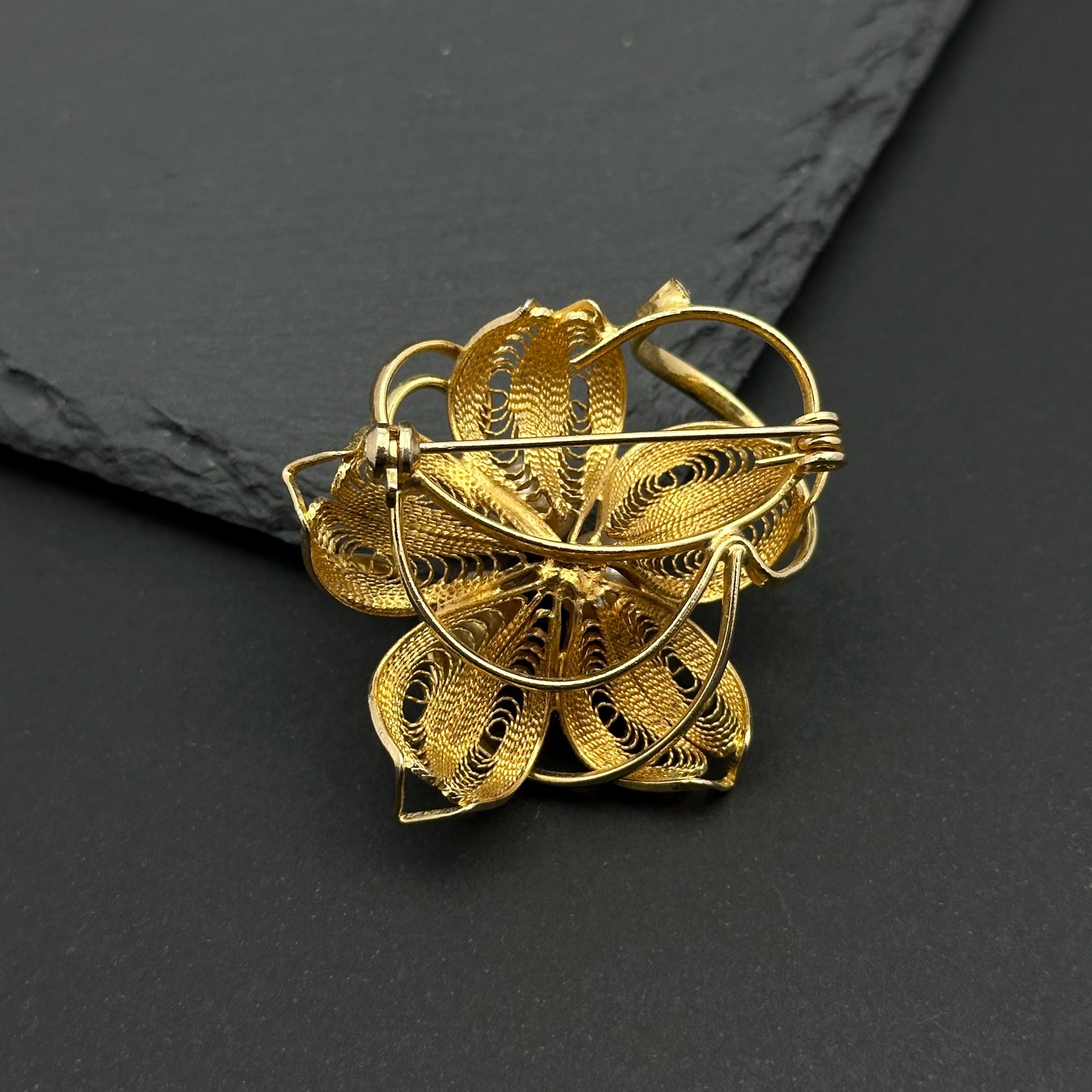 Vintage gold tone and pearl flower filigree brooch