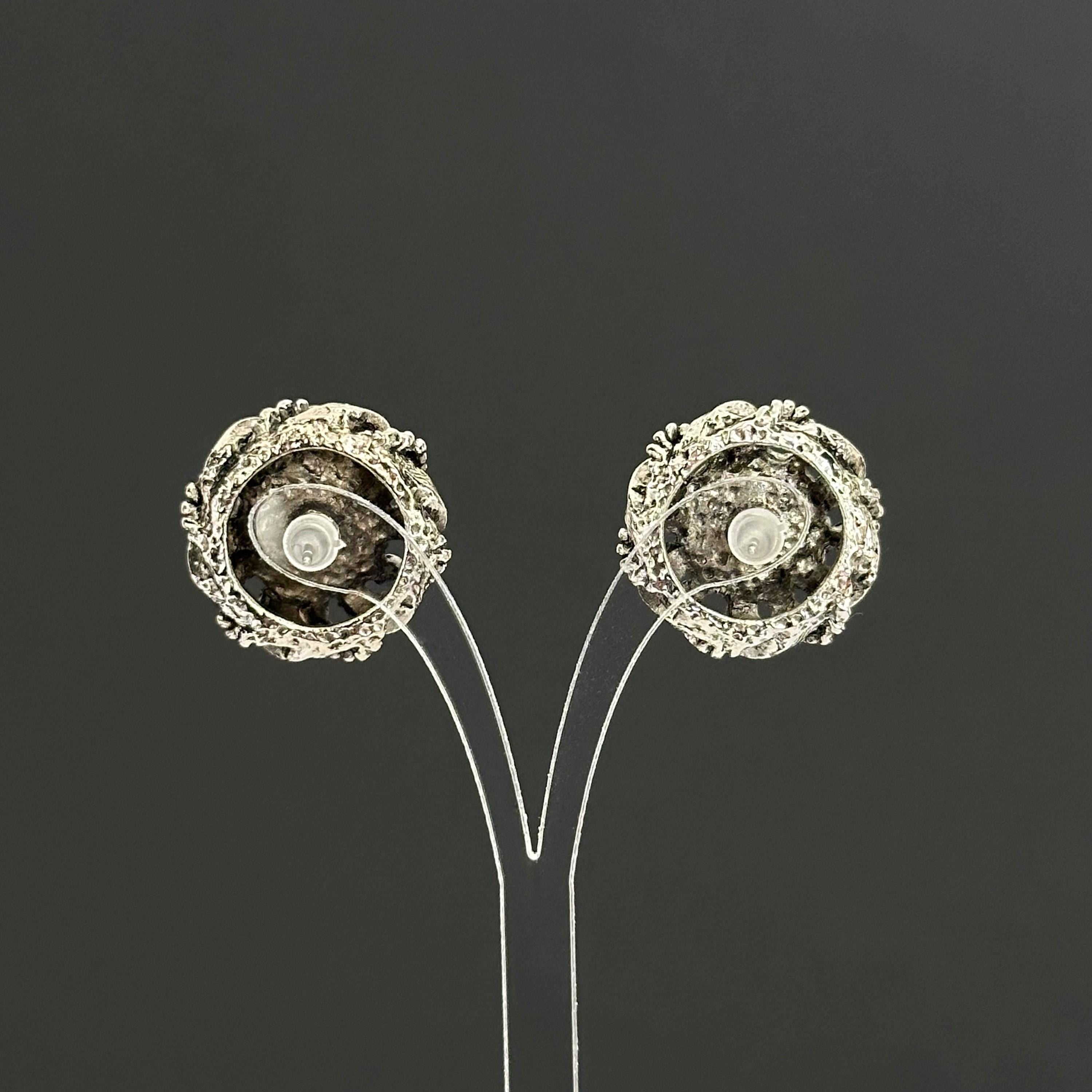 Vintage silver-tone round earrings with black plastic center