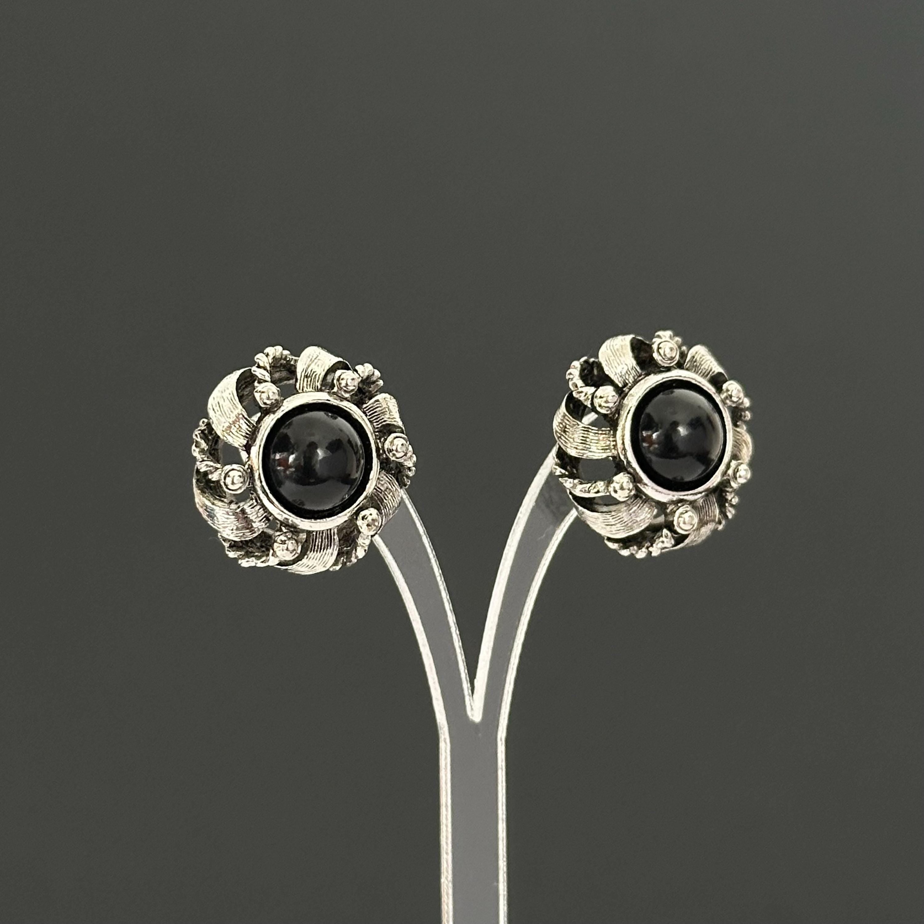 Vintage silver-tone round earrings with black plastic center