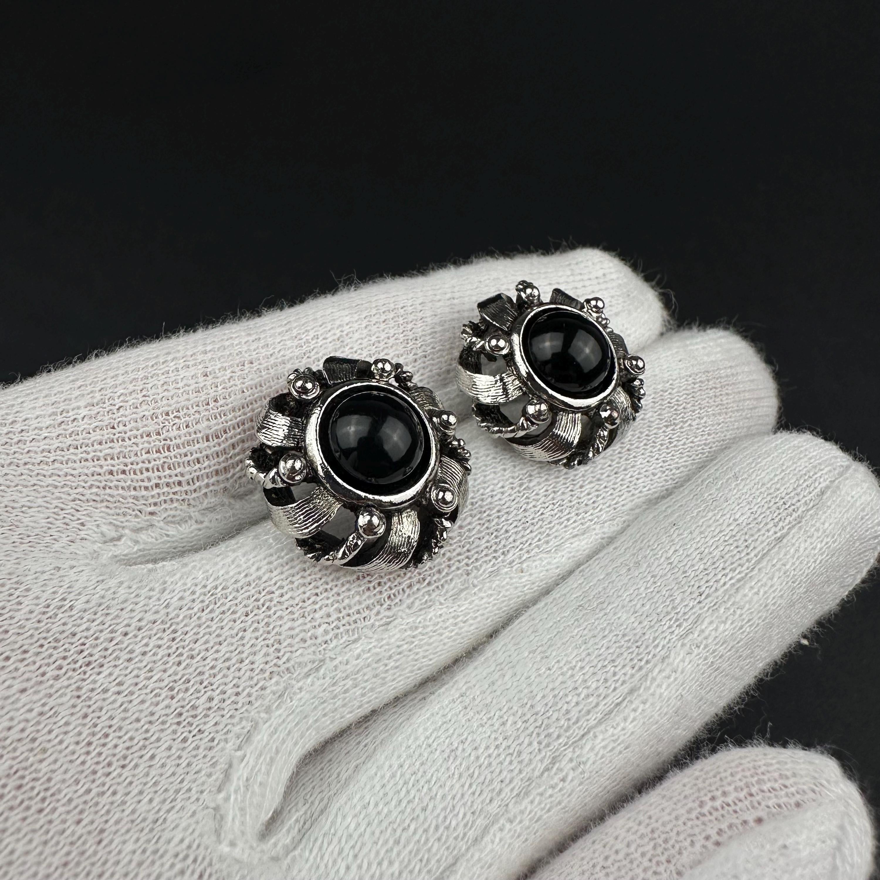 Vintage silver-tone round earrings with black plastic center