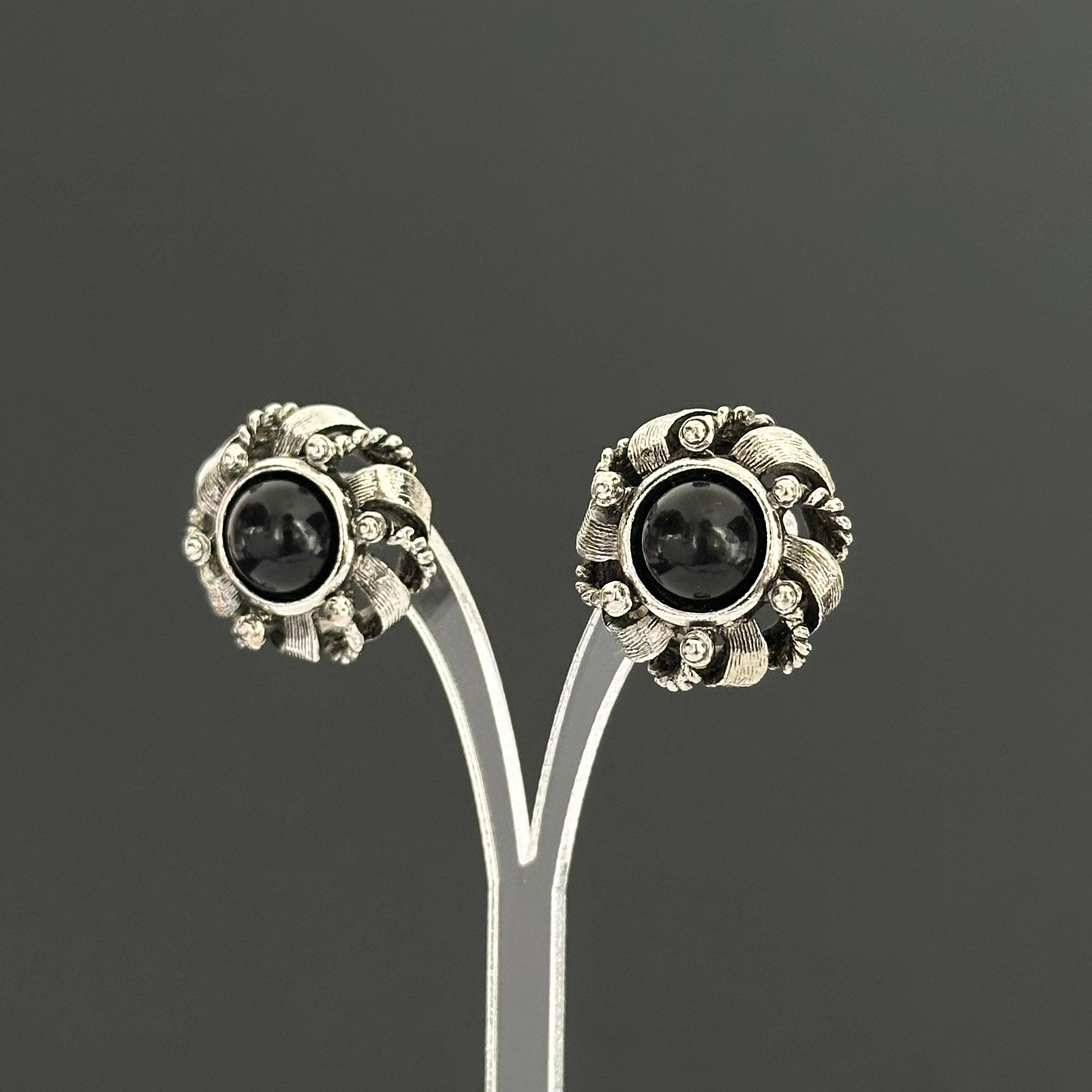 Vintage silver-tone round earrings with black plastic center