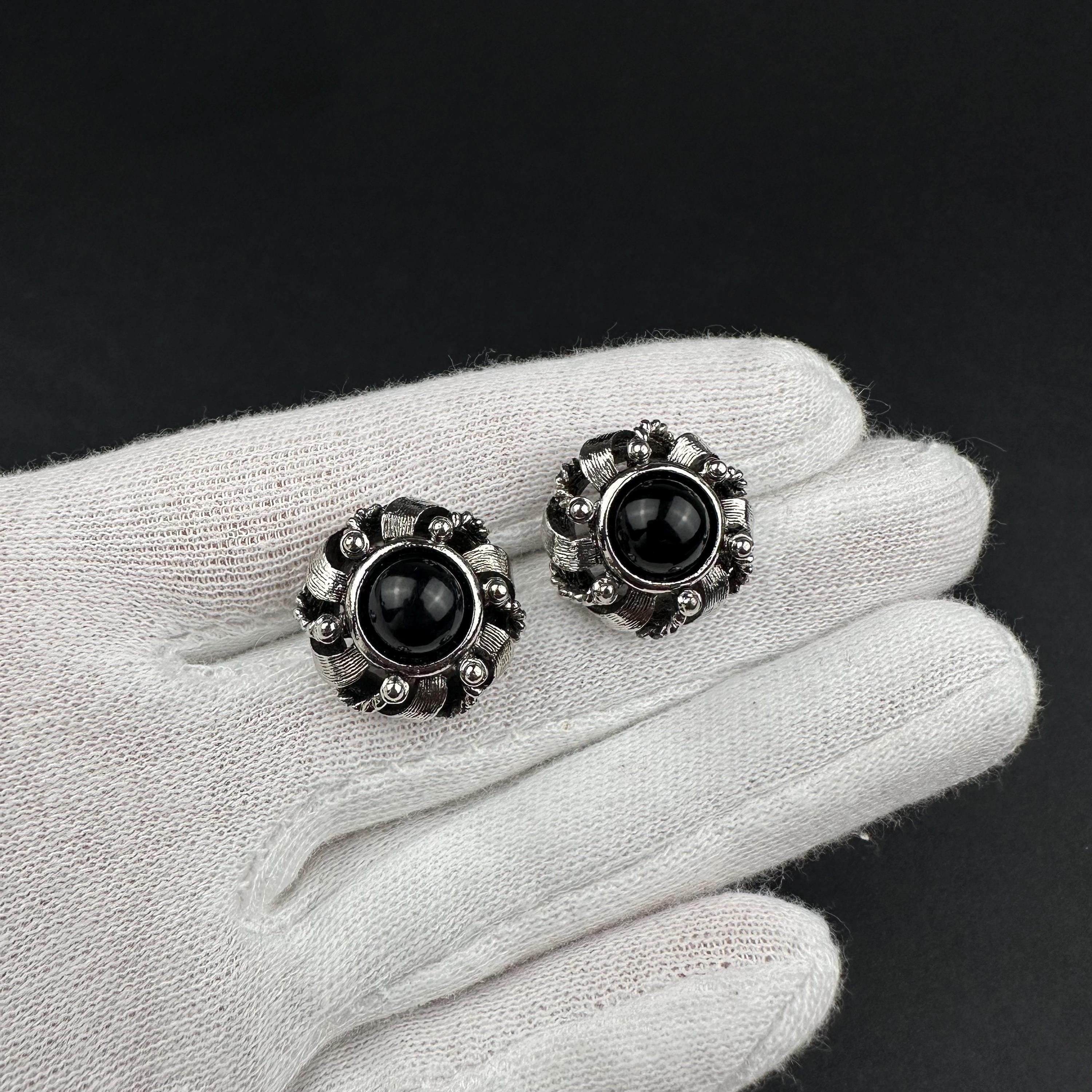 Vintage silver-tone round earrings with black plastic center