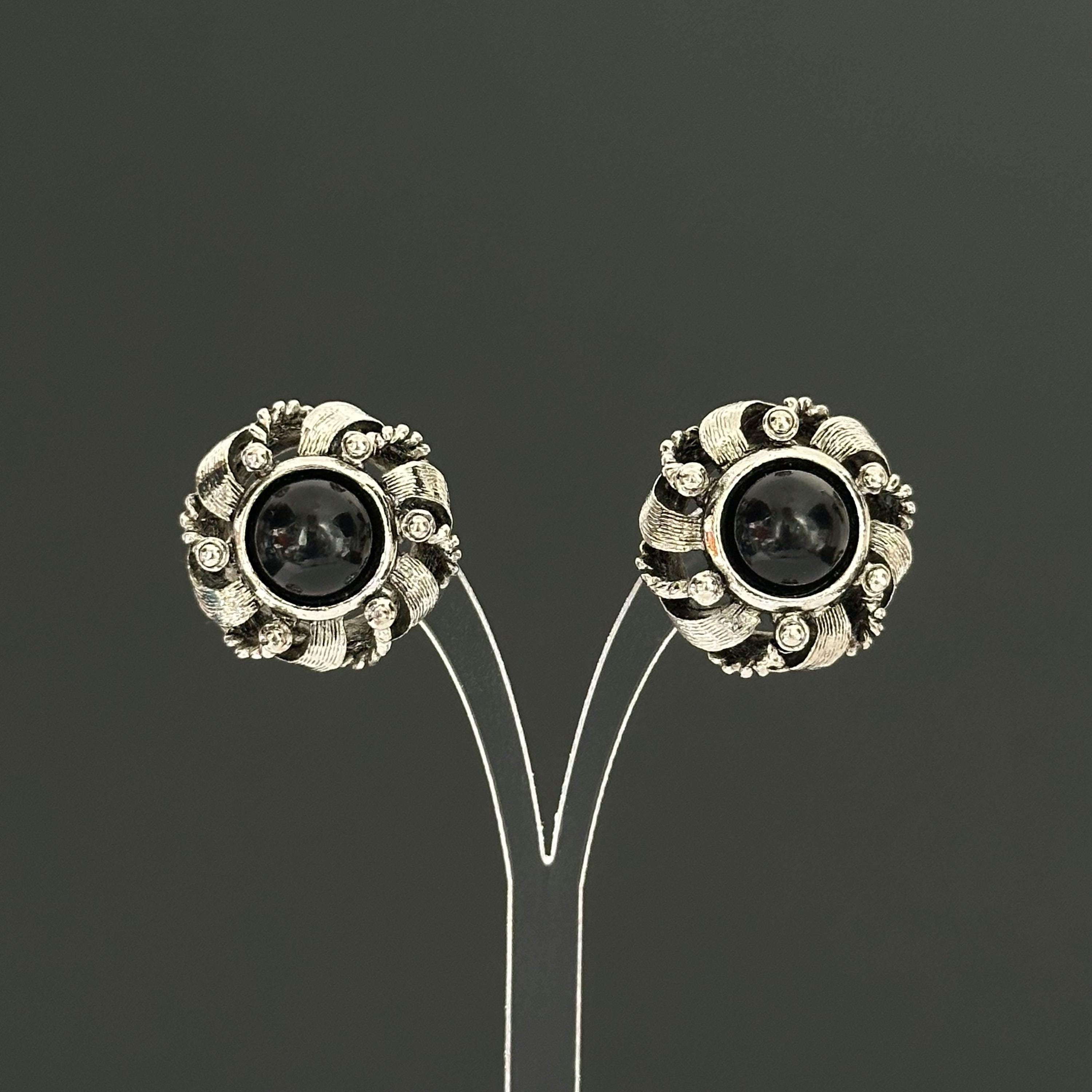 Vintage silver-tone round earrings with black plastic center