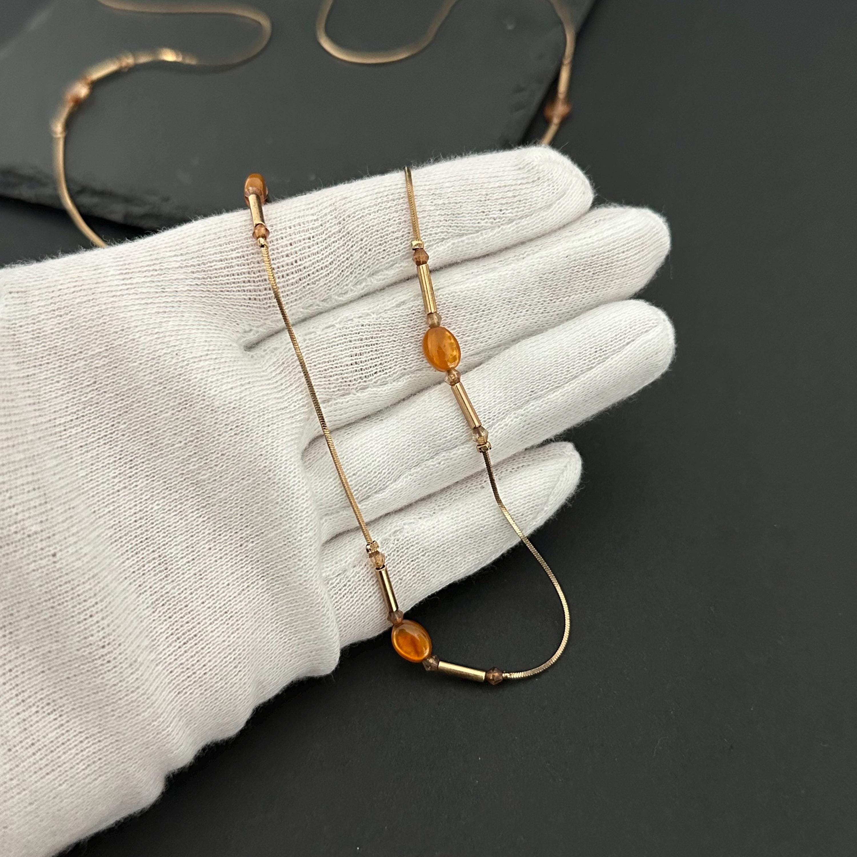 Vintage long gold-tone and amber plastic beads necklace
