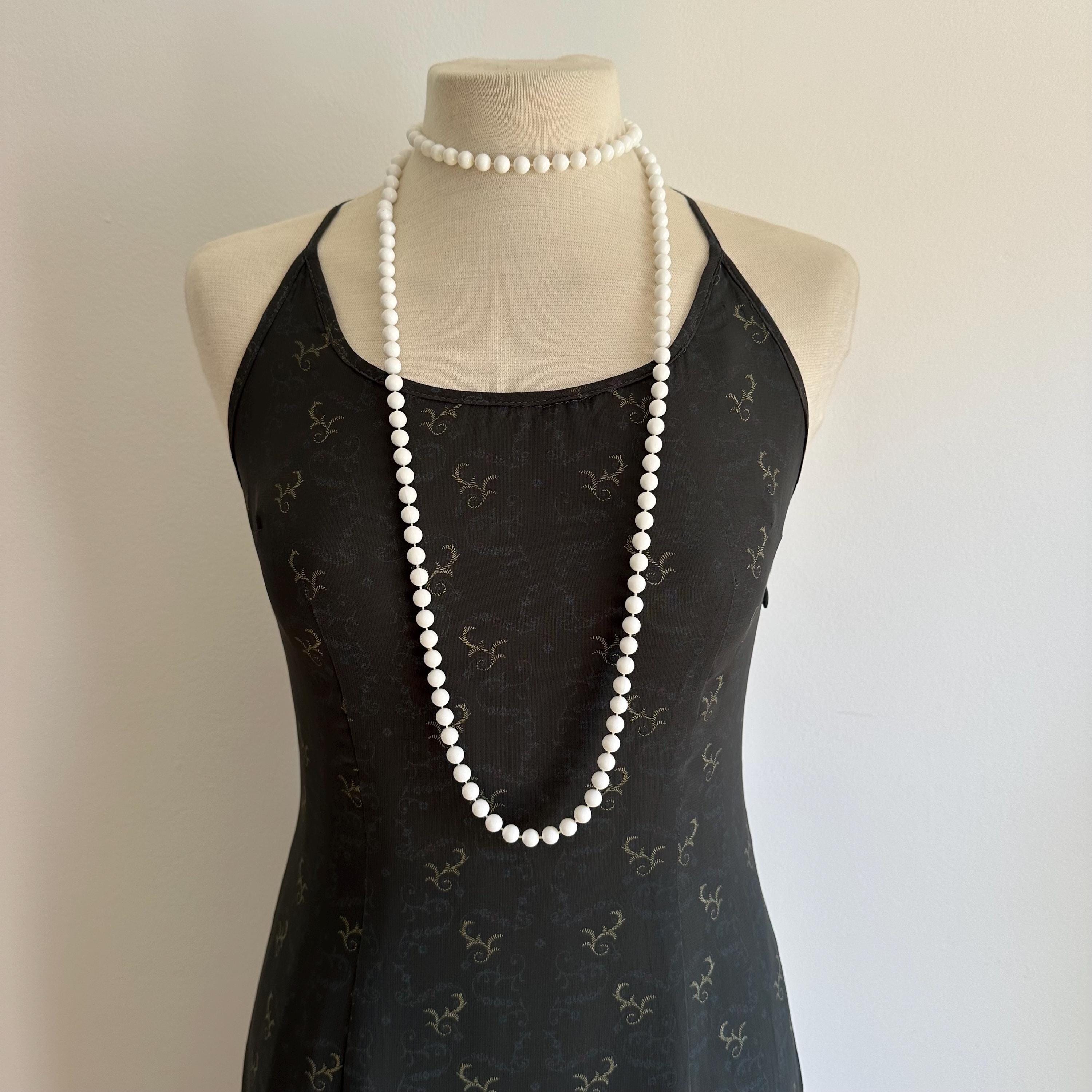 Vintage long white plastic bead necklace