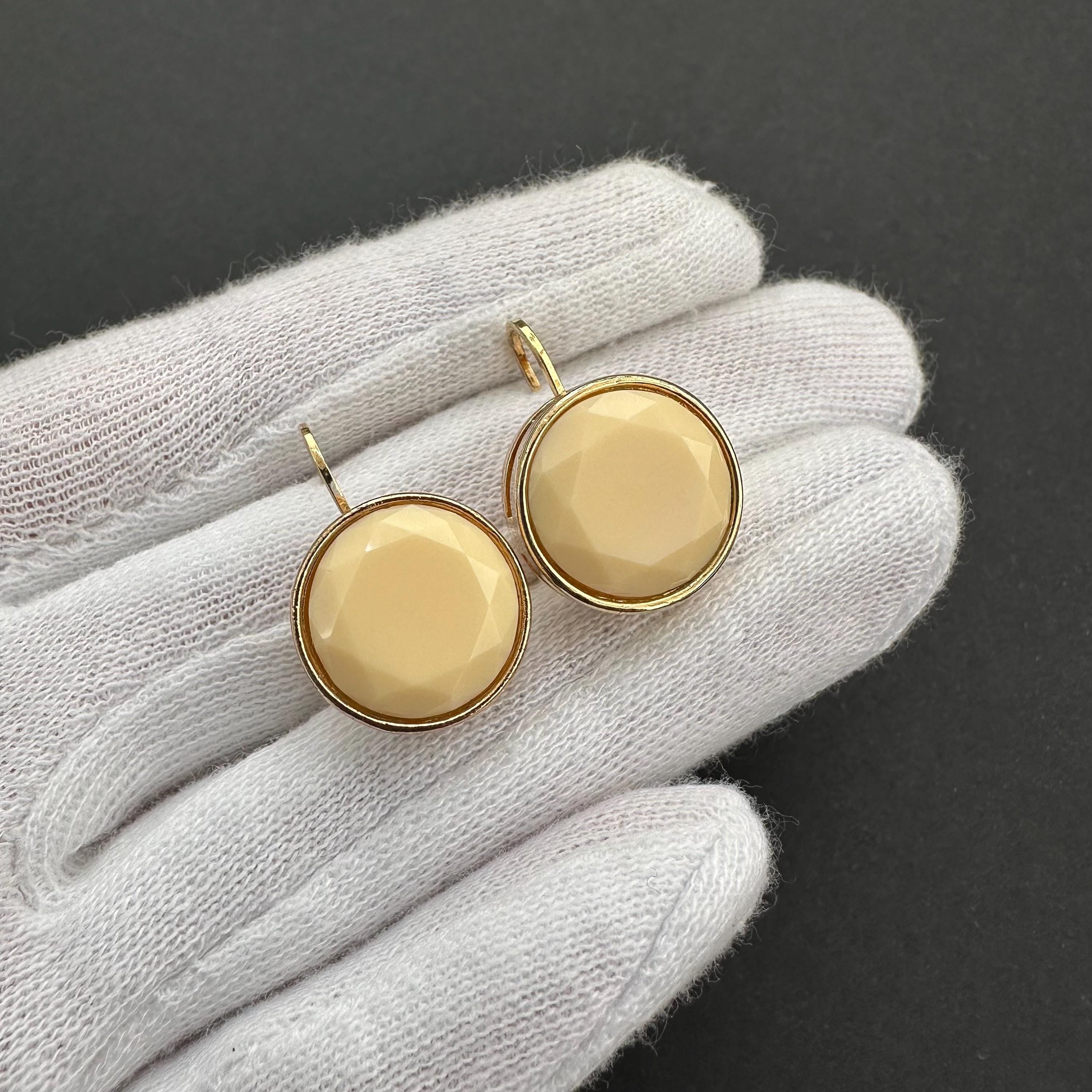 Vintage gold-tone and beige cabochons dangle openwork earrings