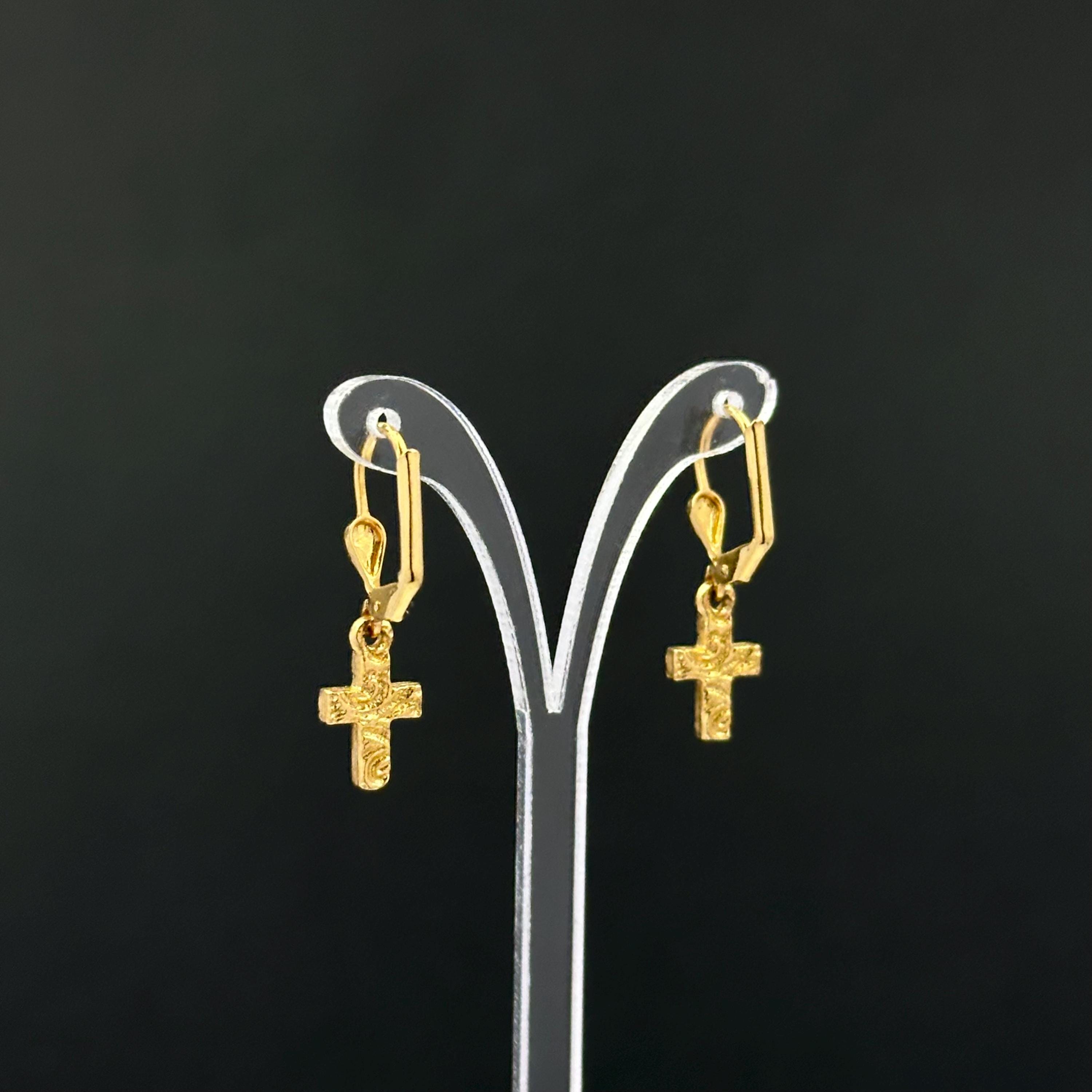 Vintage 1928 gold tone cross drop earrings with clear rhinestones