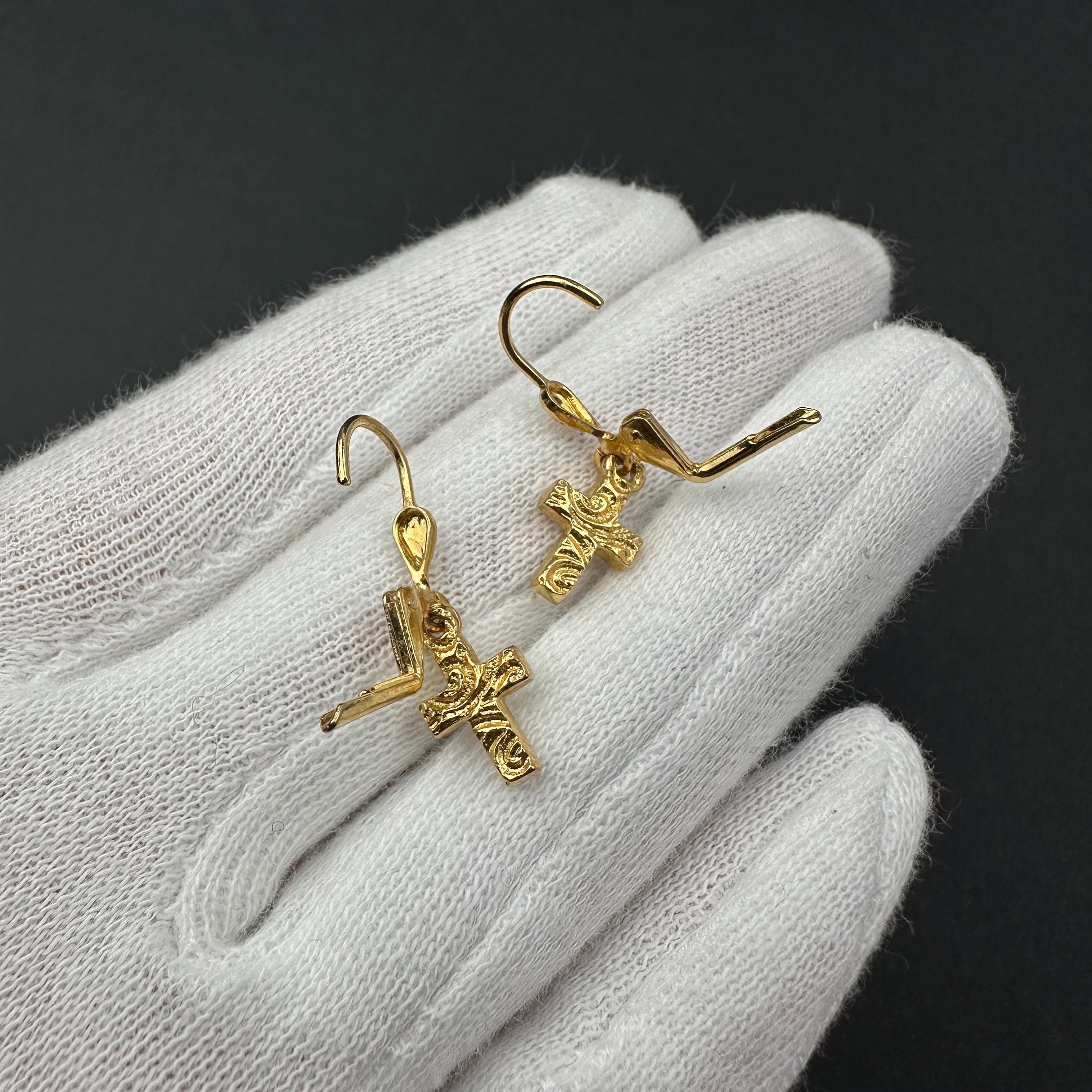 Vintage 1928 gold tone cross drop earrings with clear rhinestones